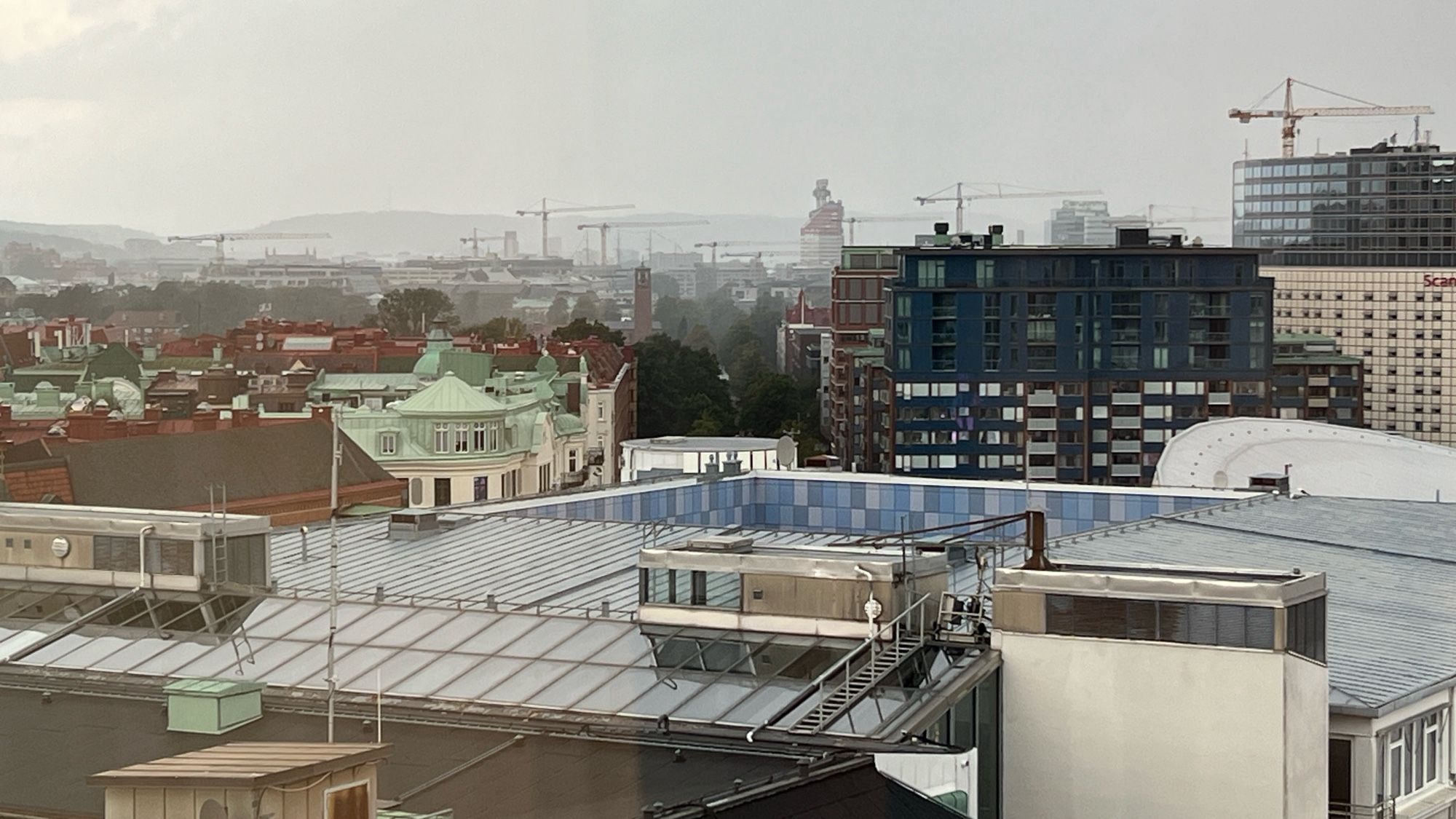 View of Gothenburg with many cranes in the background