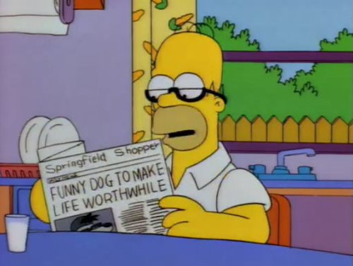 Homer Simpson, wearing his tiny reading glasses