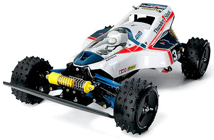 a Tamiya Thundershot RC car, an aerodynamic dune buggy with knobby tires  and a yellow suspension.