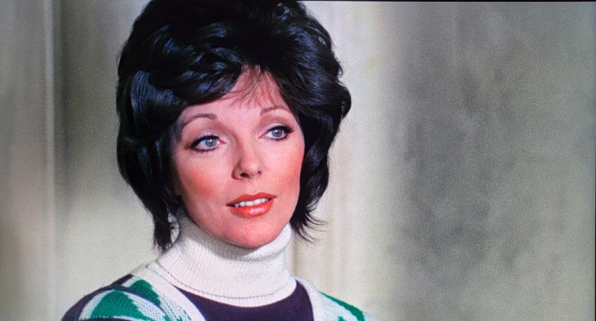 Joan Collins, looking sophisticated, as usual.