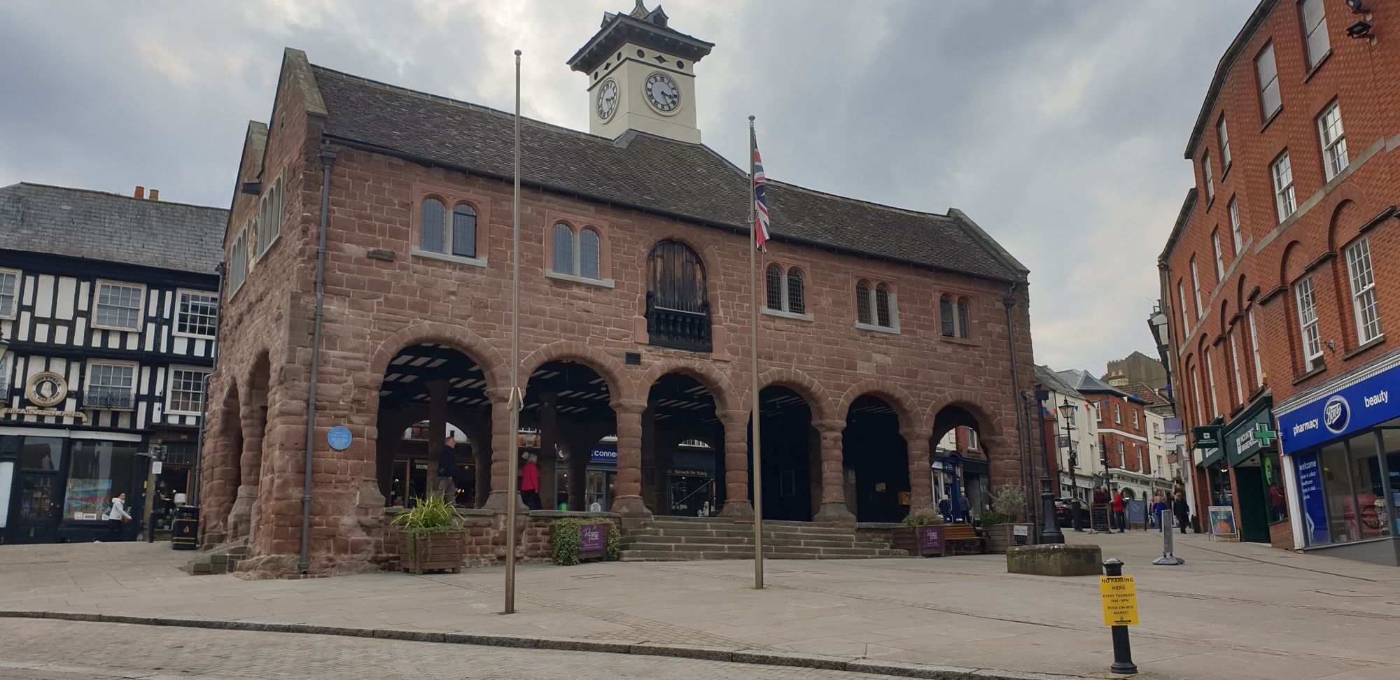 A stone two storey building with the lower floor left open as a market place. Ross on Wye, Herefordshire, recently refurbished as the stone had become badly perished in places.
The upper floor is used as an art gallery and community space.