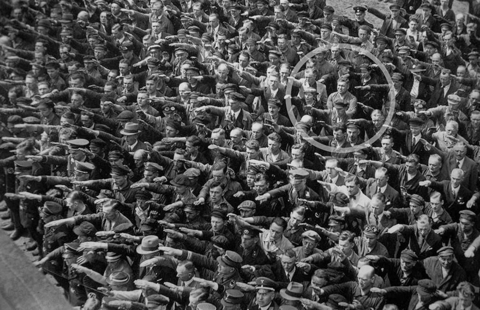 Single man at Nazi rally in Germany not doing salute.