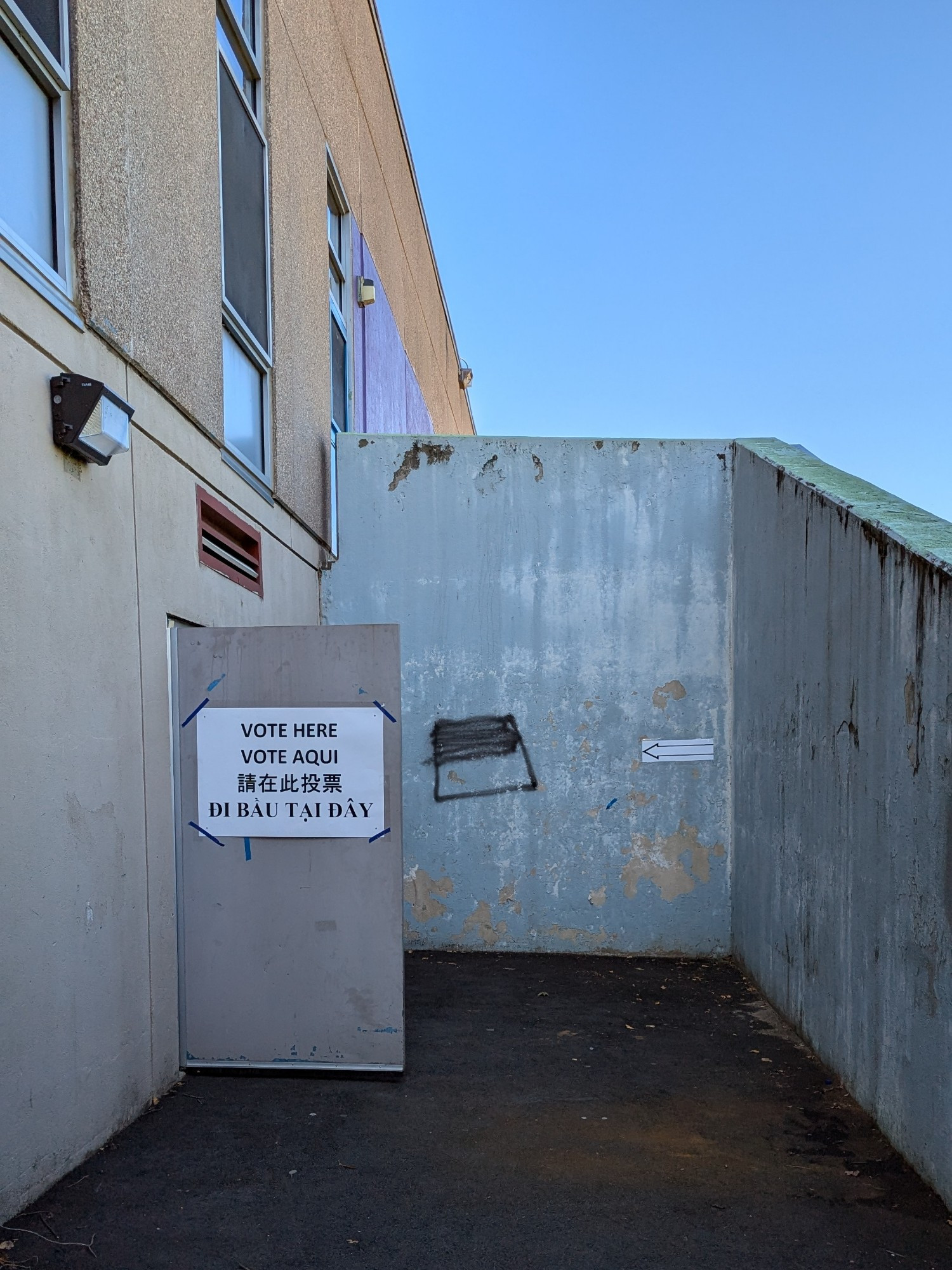 "Vote Here" sign at a public school.