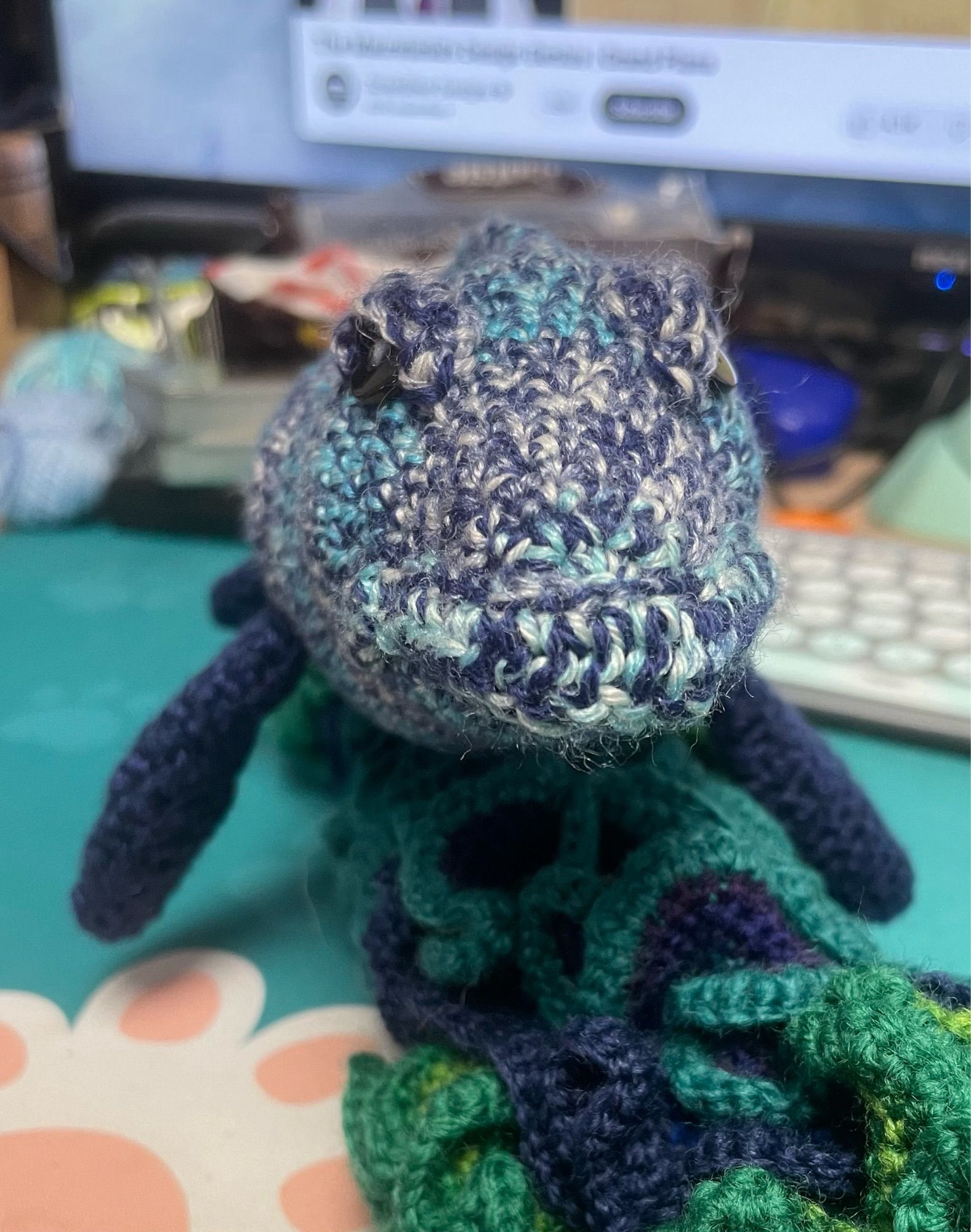 Head-on view of crocheted mosasaur