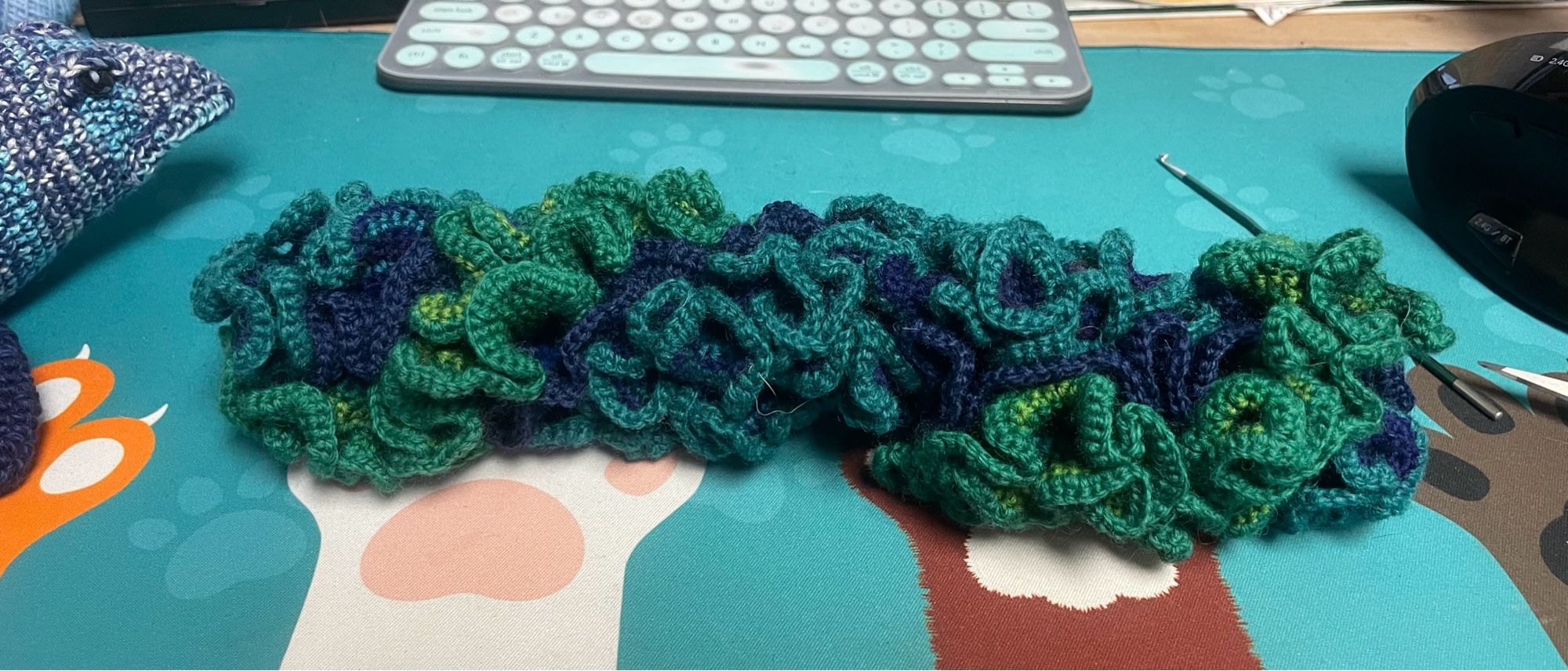 Hyperbolic crochet coral in blues, greens, and in-between teals.