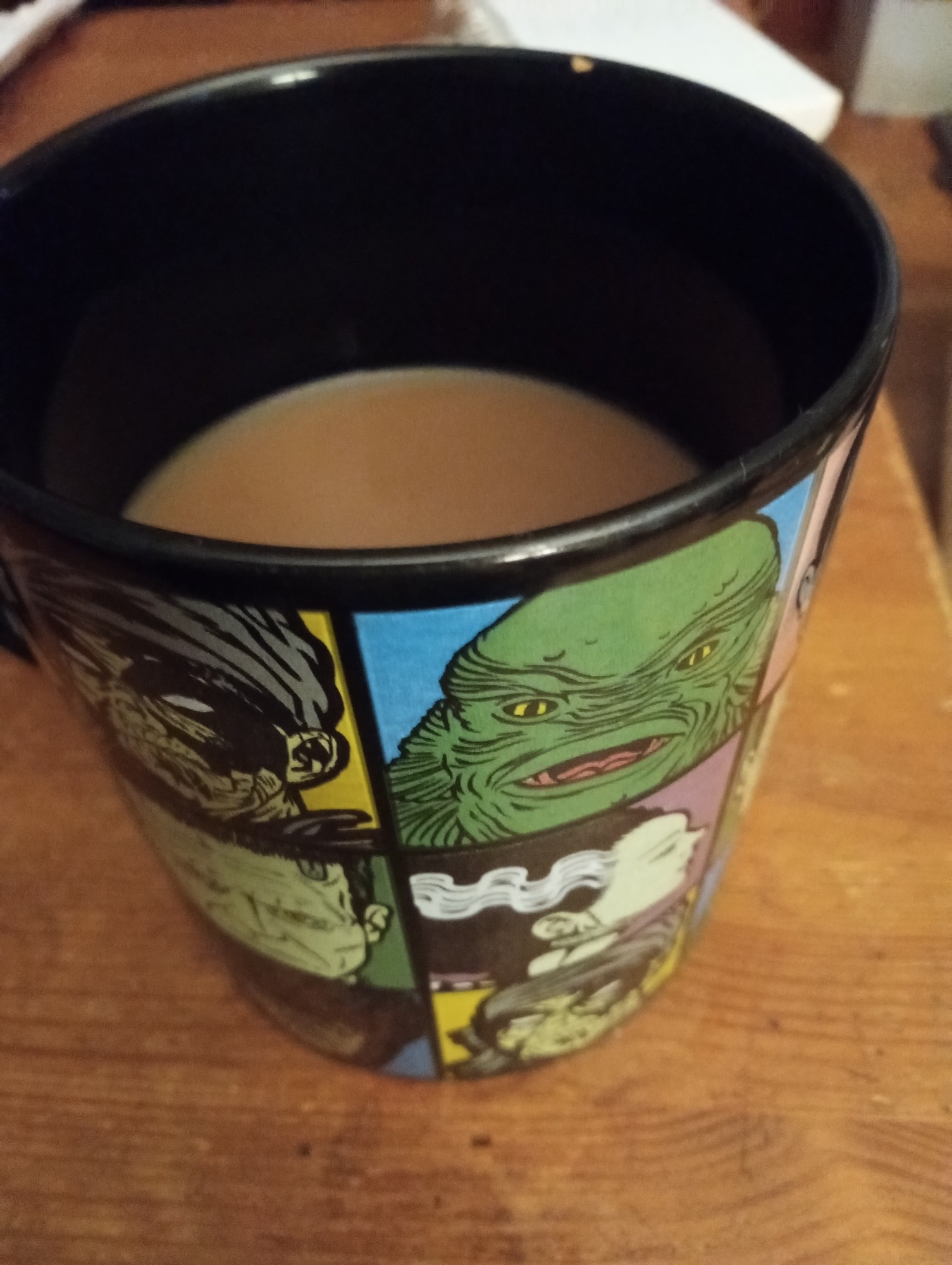 Coffee. In a Universal Monsters mug. Added nondairy creamer this morning, don't know why, just felt right.