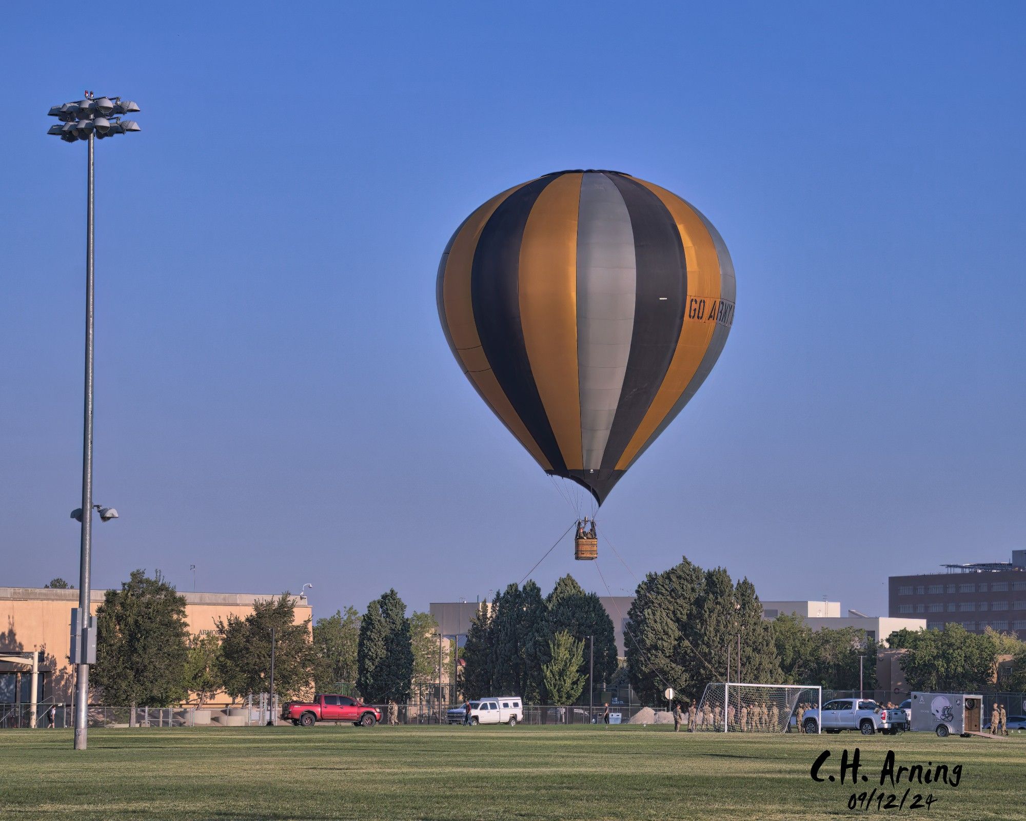 My 09/12/24 captures the ROTC launching a hot air balloon at Johnson Field. In the crisp morning air, the balloon made a short ascent a couple of times before the air got too warm.