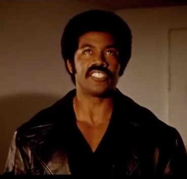 black dynamite from the film black dynamite performatively looking up to indicate that he is not even looking to check cause he already knows