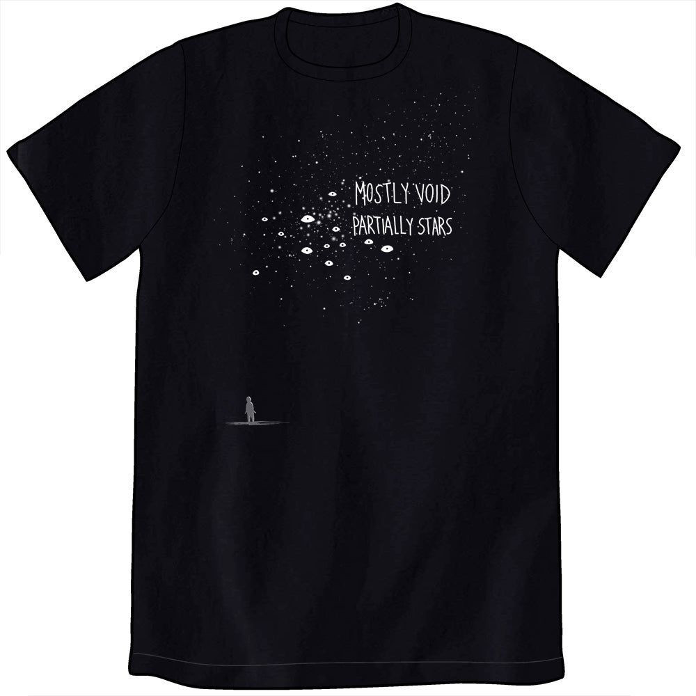 A black t-shirt. On the middle left side there is a shadow figure looking up. Above the figure are many white pinpoints of various sizes and brightness, with a few small eye shapes mixed in. The text, overlapping the dots, says: Mostly Void, partially stars.