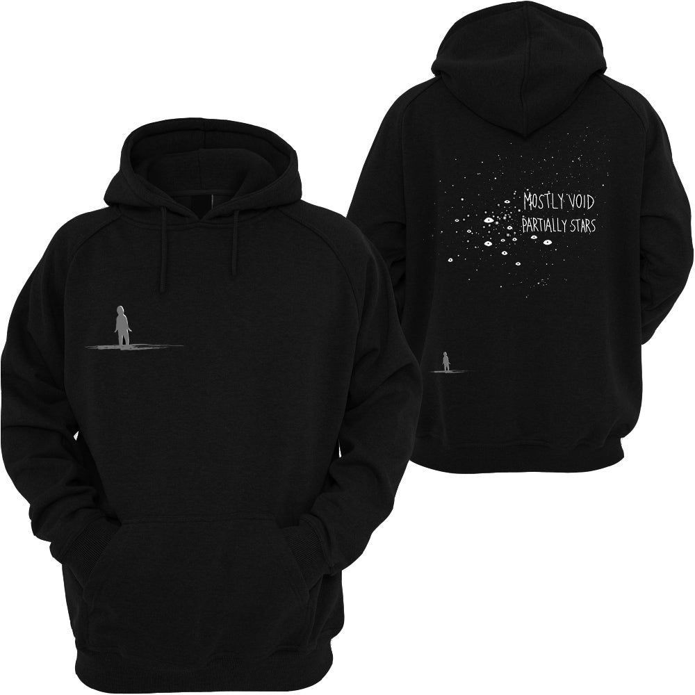 A black hoodie. On the front left there is a shadow figure looking up. On the back is the same shadow figure at the bottom left, looking up. Above the figure are many white pinpoints of various sizes and brightness, with a few small eye shapes mixed in. The text, overlapping the dots, says: Mostly Void, partially stars.