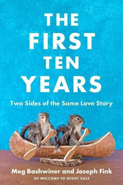 The First Ten Years book cover has a blue background, like it was sponged painted on. A wood table at the bottom. On the table on a live edge wood stand, is a wooden canoe with two squirrels sitting inside, each with a paddle in its hands.  Above the squirrels is the book title in bold white print: The First Ten Years and below this in smaller print: Two Sides of the Same Love Story.