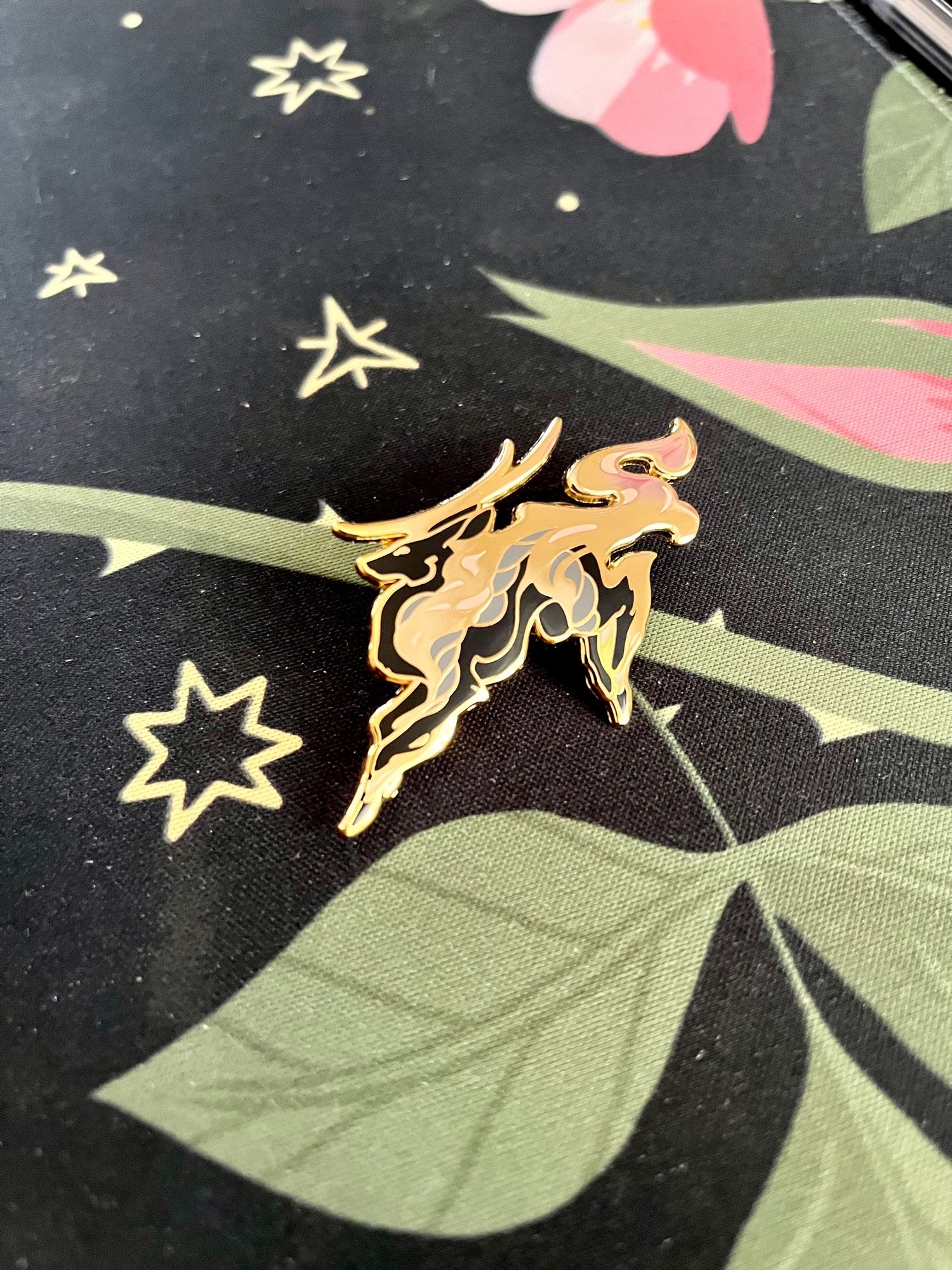 Gold hard enamel pin of a kirin