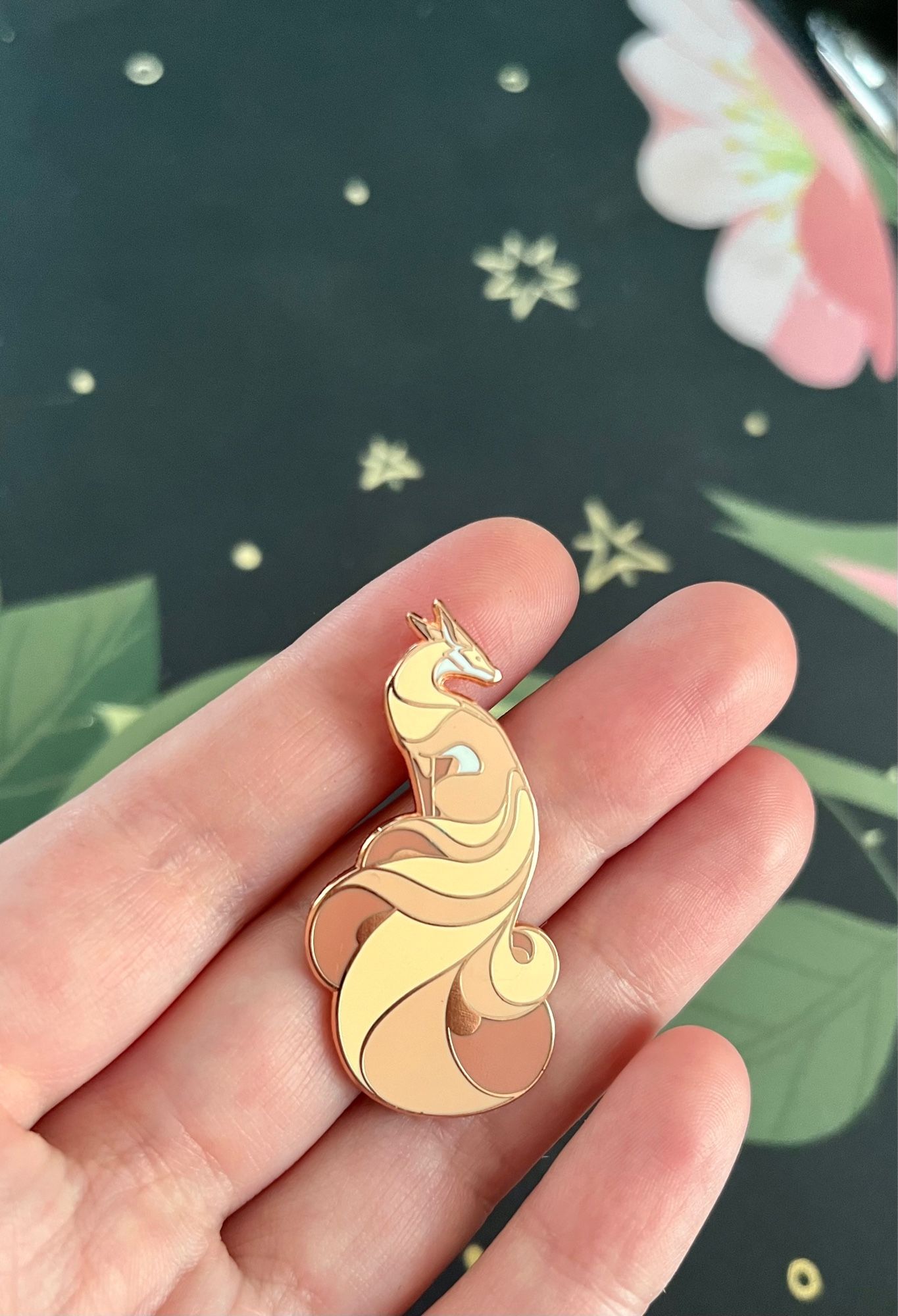 Rose gold hard enamel pin of a kitsune