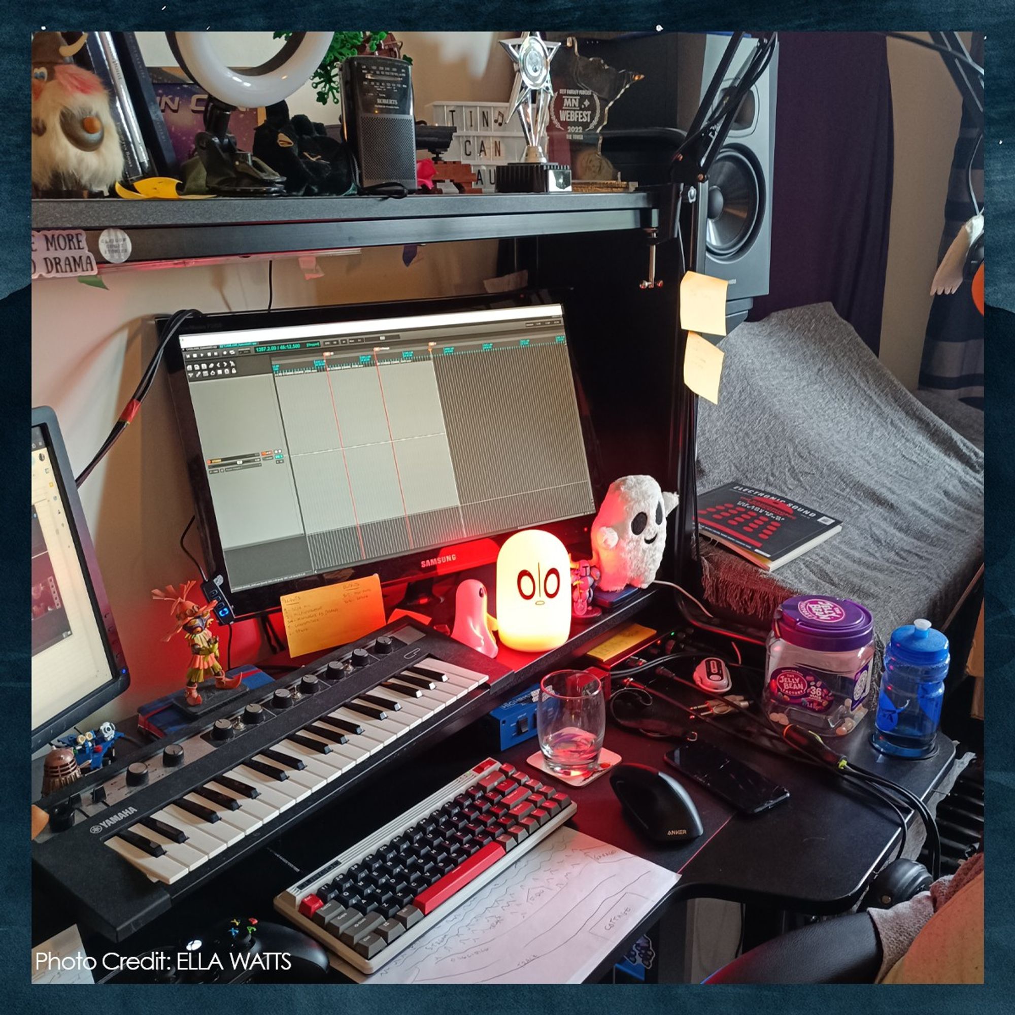 A photo of Amber's desk, cluttered with trophies and nerd merch