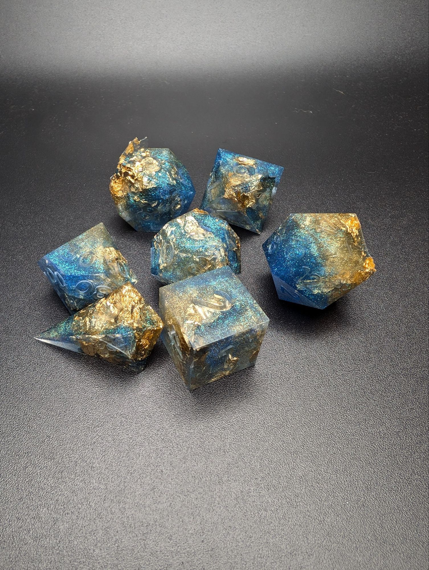 clear blue and gold dnd raw dice set fresh out of a mold