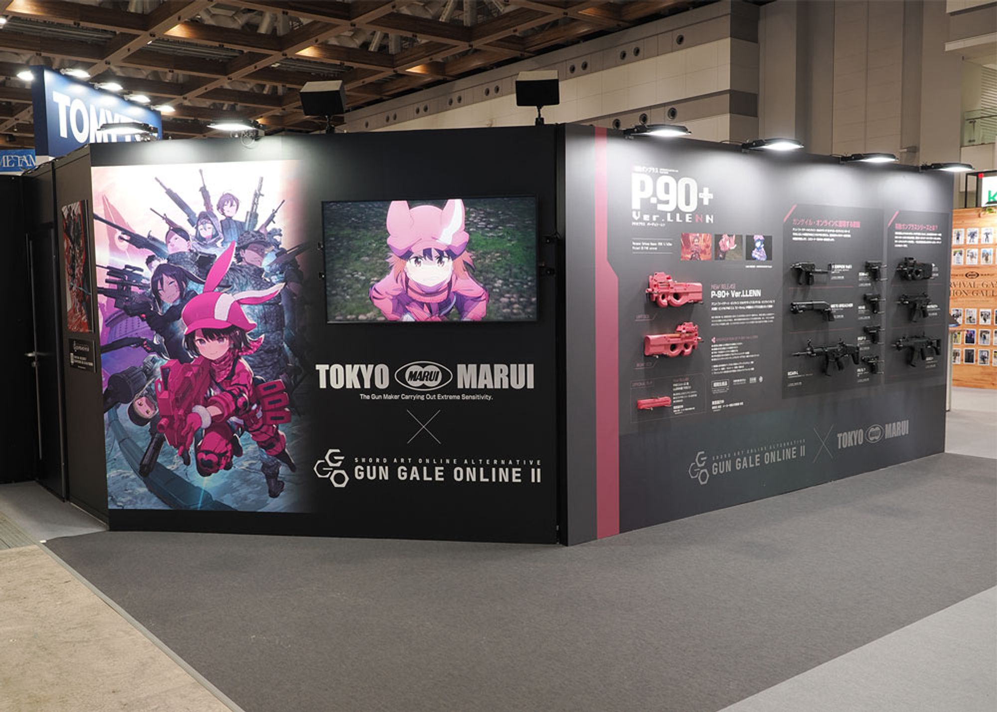 Tokyo Marui booth displaying the P-90+ Ver.LLENN airsoft gun at the 62nd All Japan Model & Hobby Show