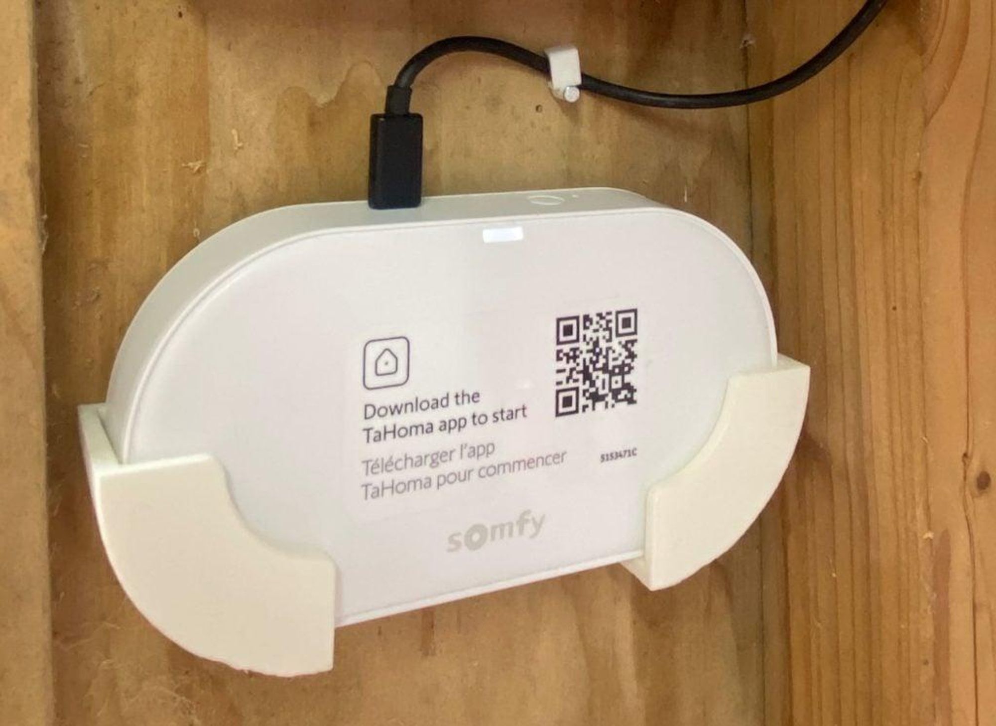 Somfy Connectivity Kid in a 3D printed bracket screwed into a wooden wall