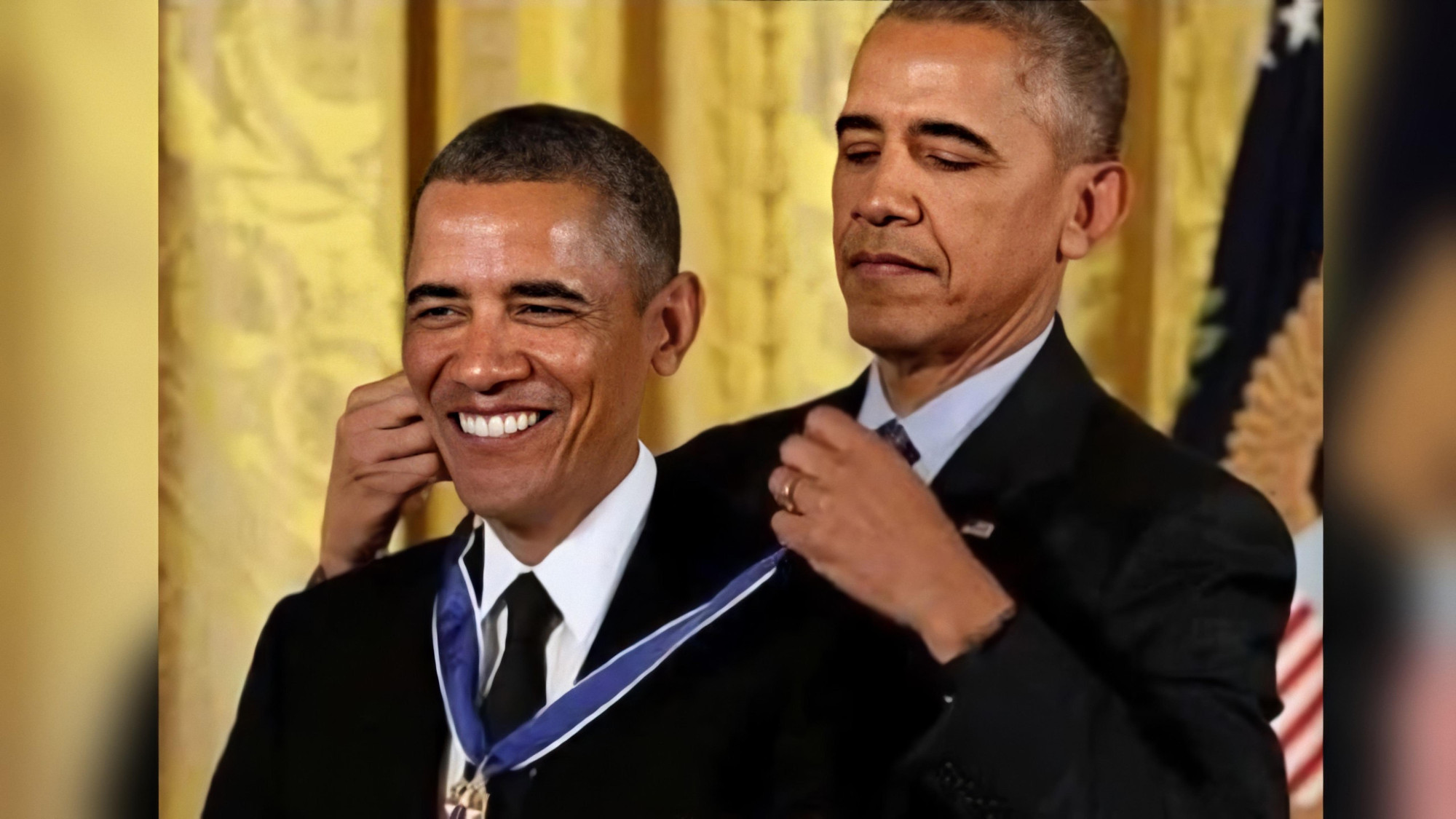 Barack Obama placing a medal around the neck of a second, identical Barack Obama