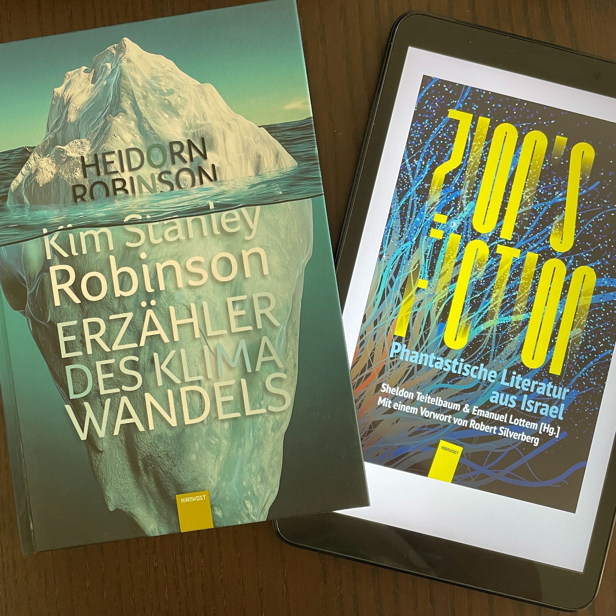 Foto von zwei Büchern: "Kim Stanley Robinson: Erzähler des Klimawandels" von Heidorn und Robinson, sowie "Zion's Fiction. Phantastische Literatur aus Israel"