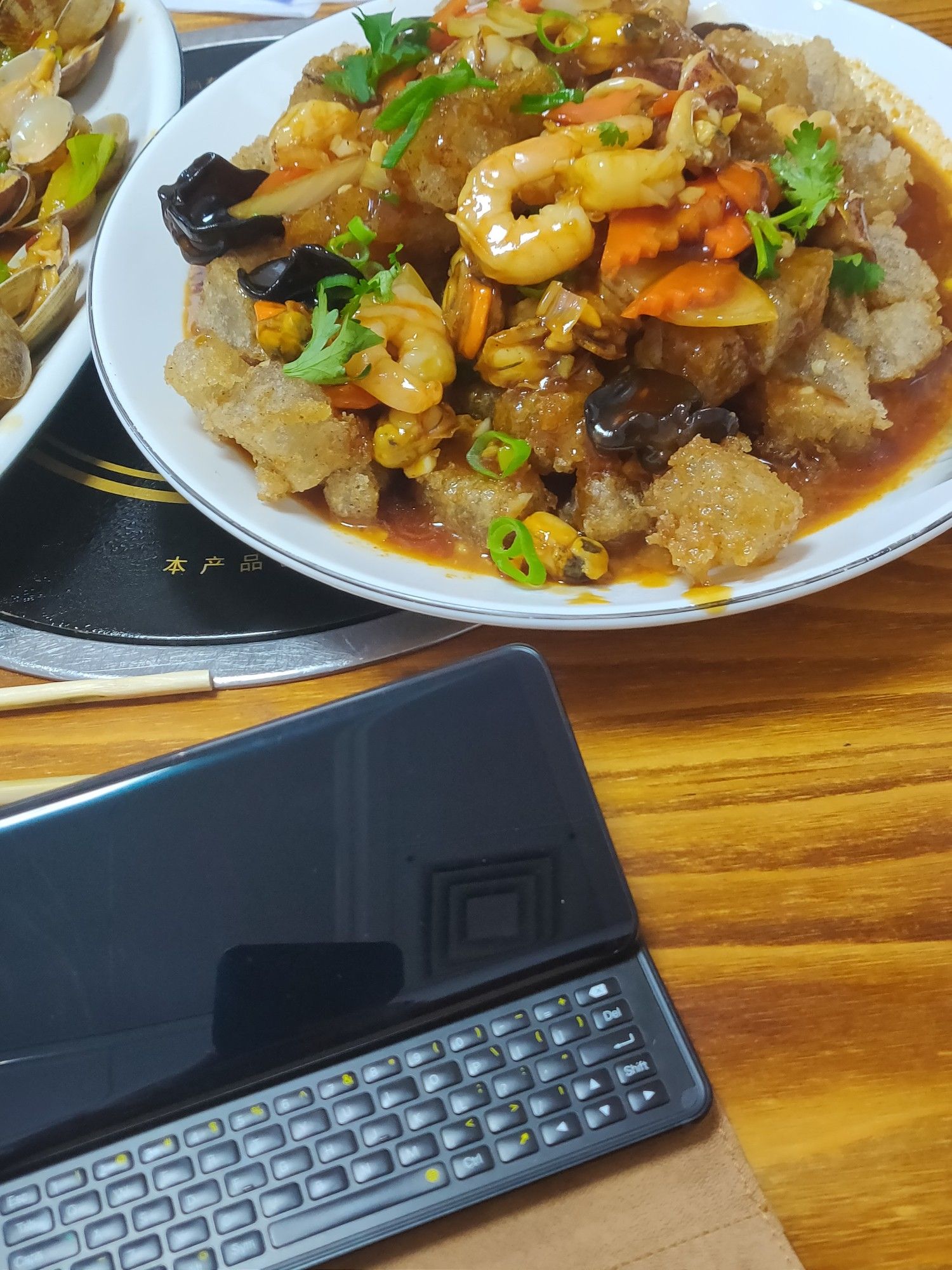 F(x)tec Pro1-X (the slide keyboard mobile phone) with Sanxian Menzi. (include some sauce, shrimp, black fungus, and carrots)  Shot in Dalian, China.