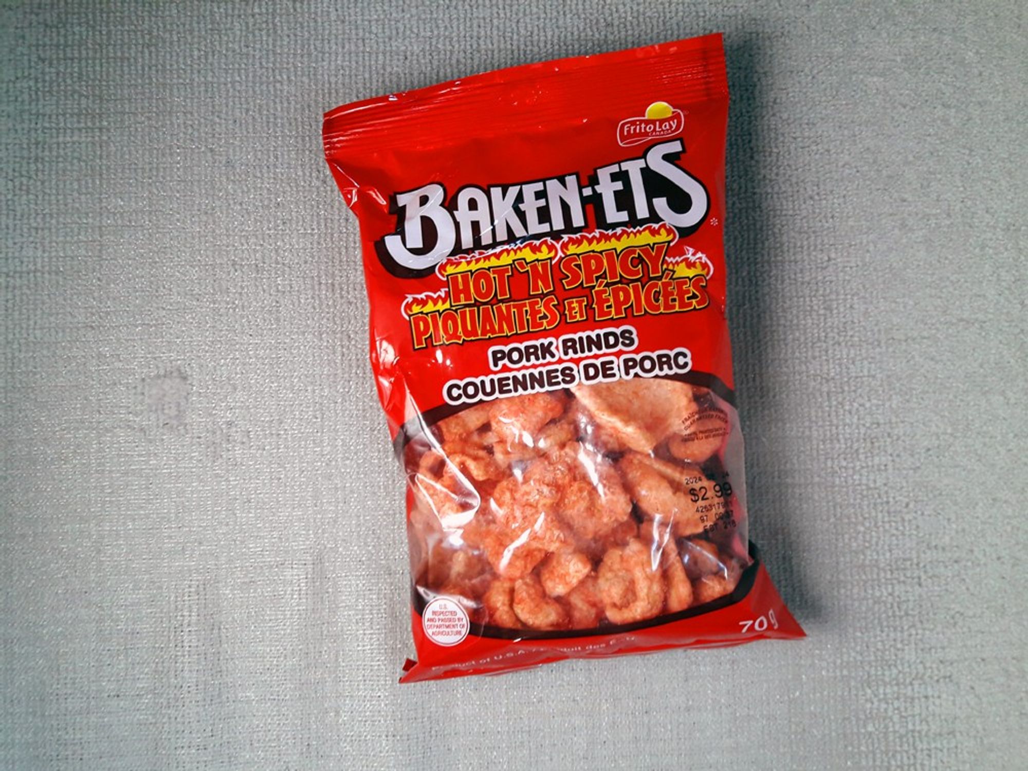 A package of super hot spicy pork rinds in a red bag. They are an adequate low carb snack. They are better than regular pork rinds that can be a bit cloying.