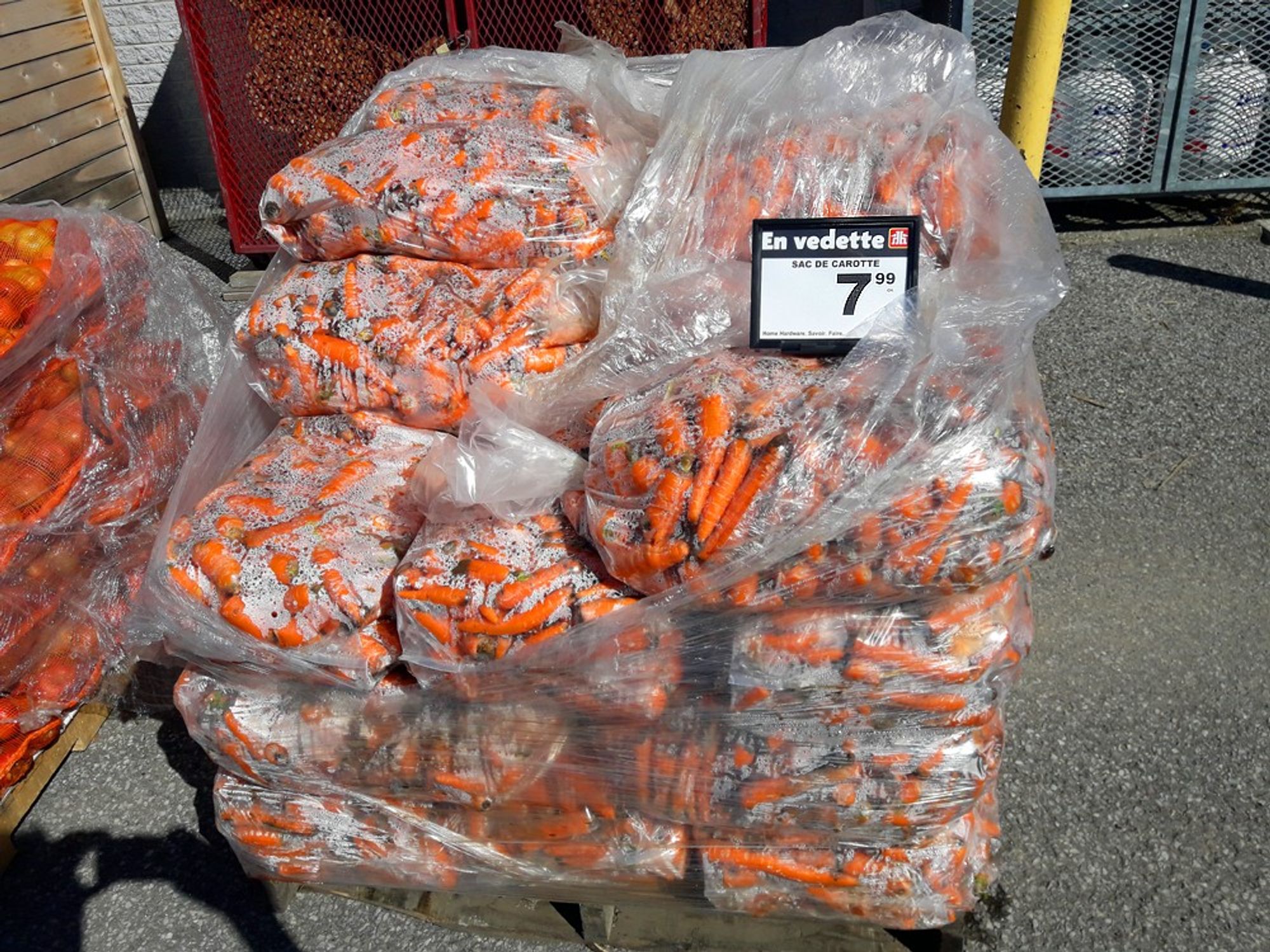 Pallets of bags of carrots, unfit for human consumption, selling for $7.99 to feed the deer.