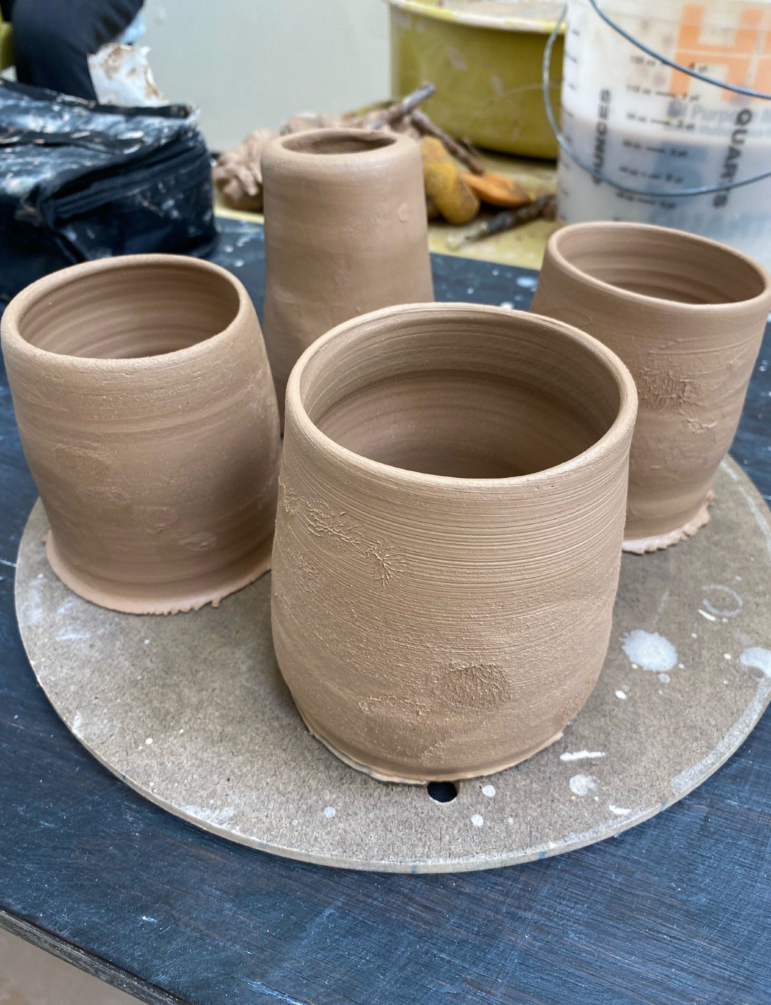 four wheelthrown pots