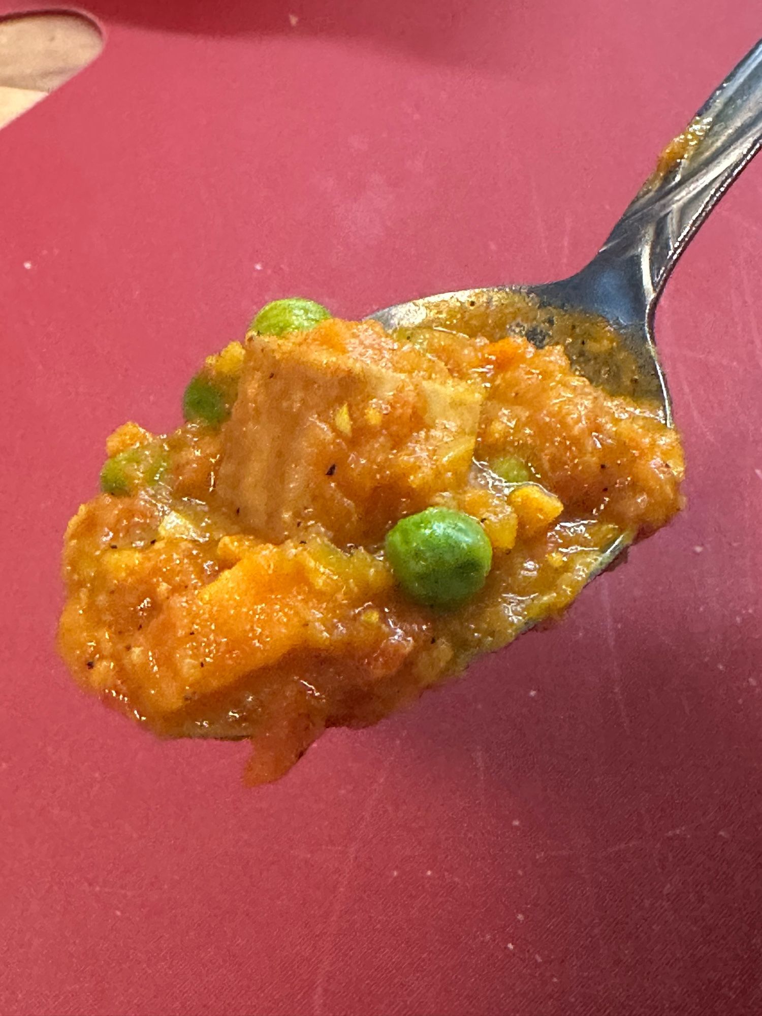 A spoonful of a masala kinda thing but with sweet potatoes and peas and fried tofu.