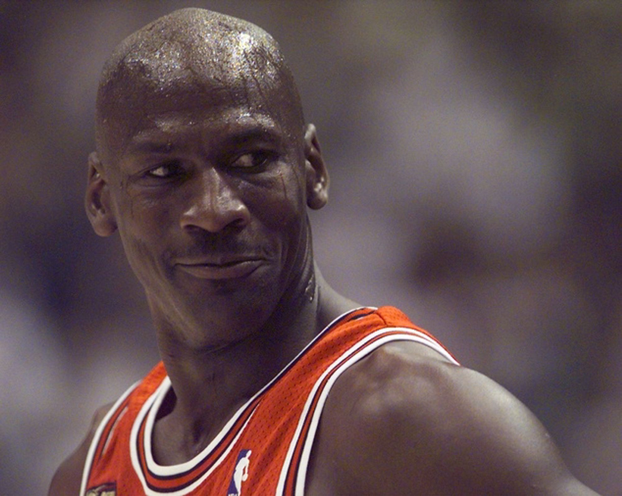 A close up of Michael Jordan in a Chicago Bulls jersey