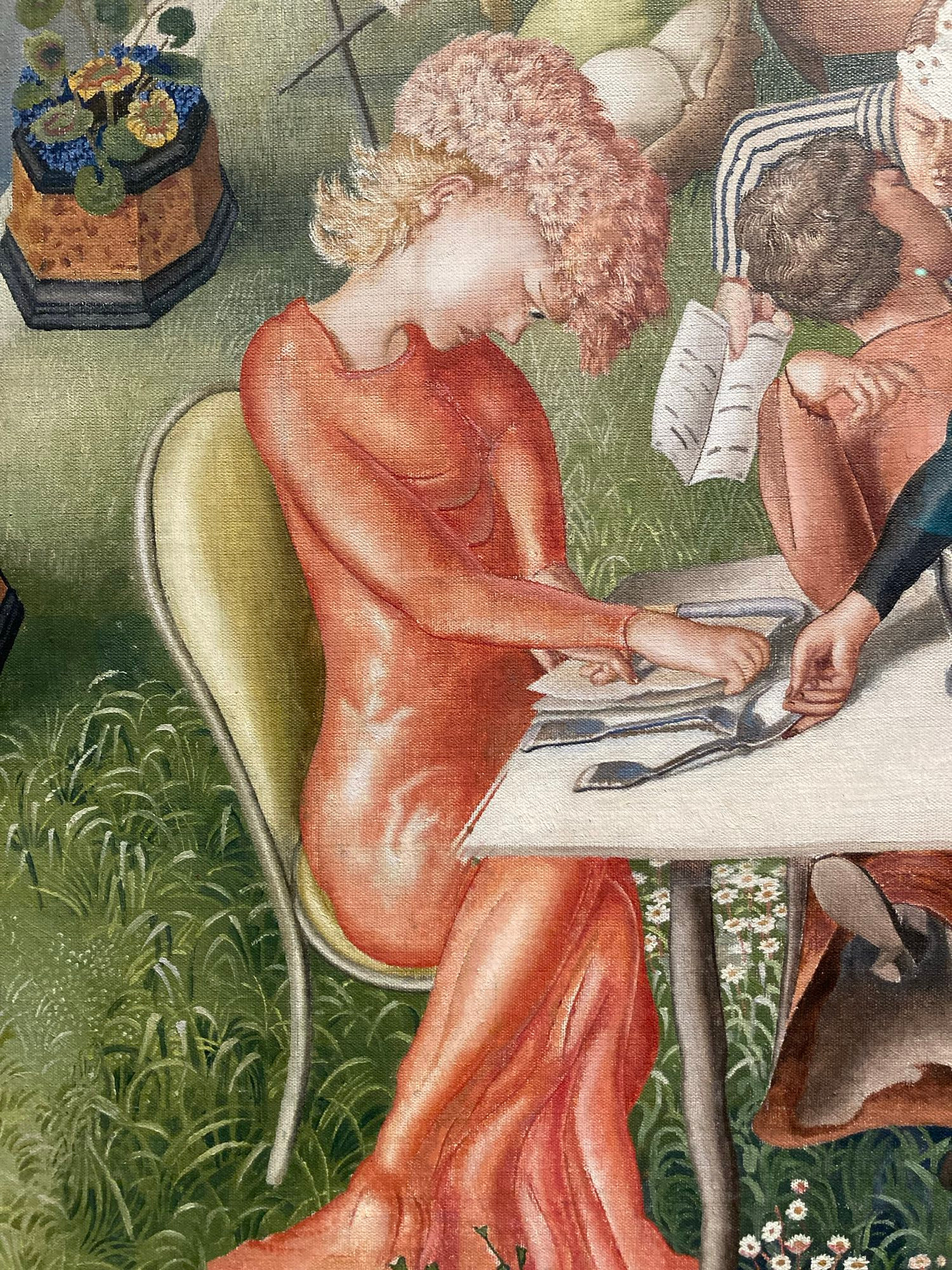 A female guest sits at the end of the table with her head bowed, looking very sad. 