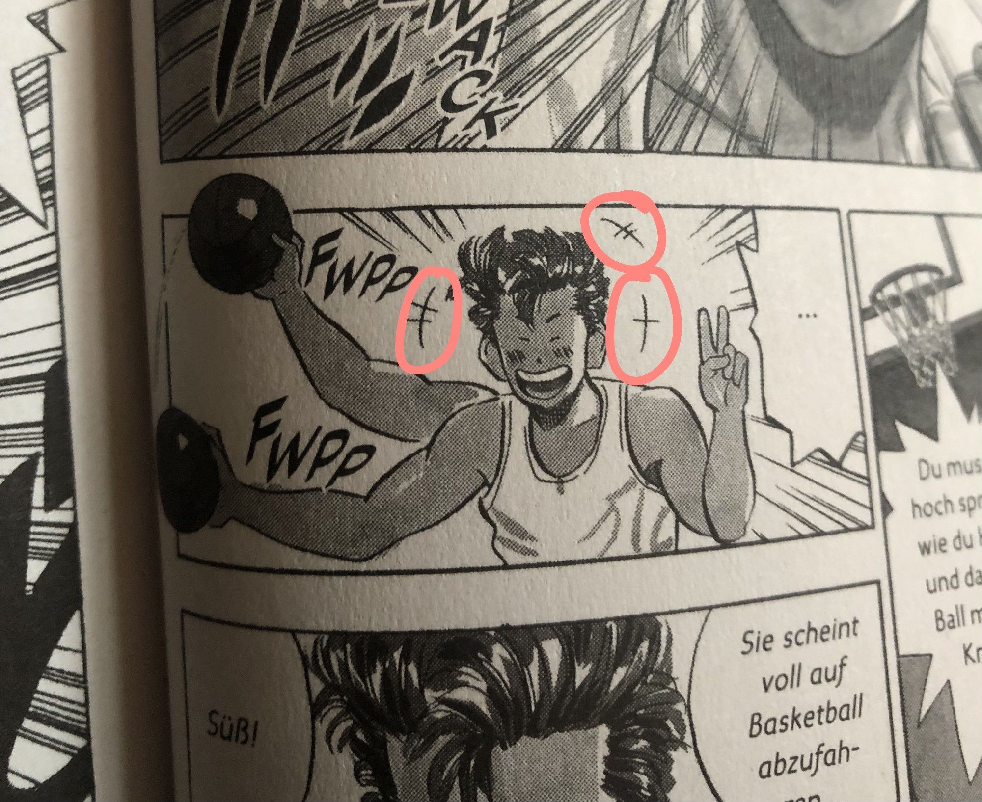 A page from the German translation of SLAM DUNK, where a little marking has been circled by the poster.