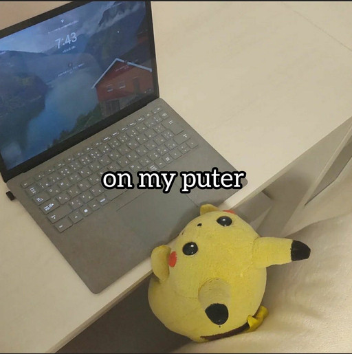 Pikachu plushie in front of a laptop with the text "on my puter" overlayed, it's cute