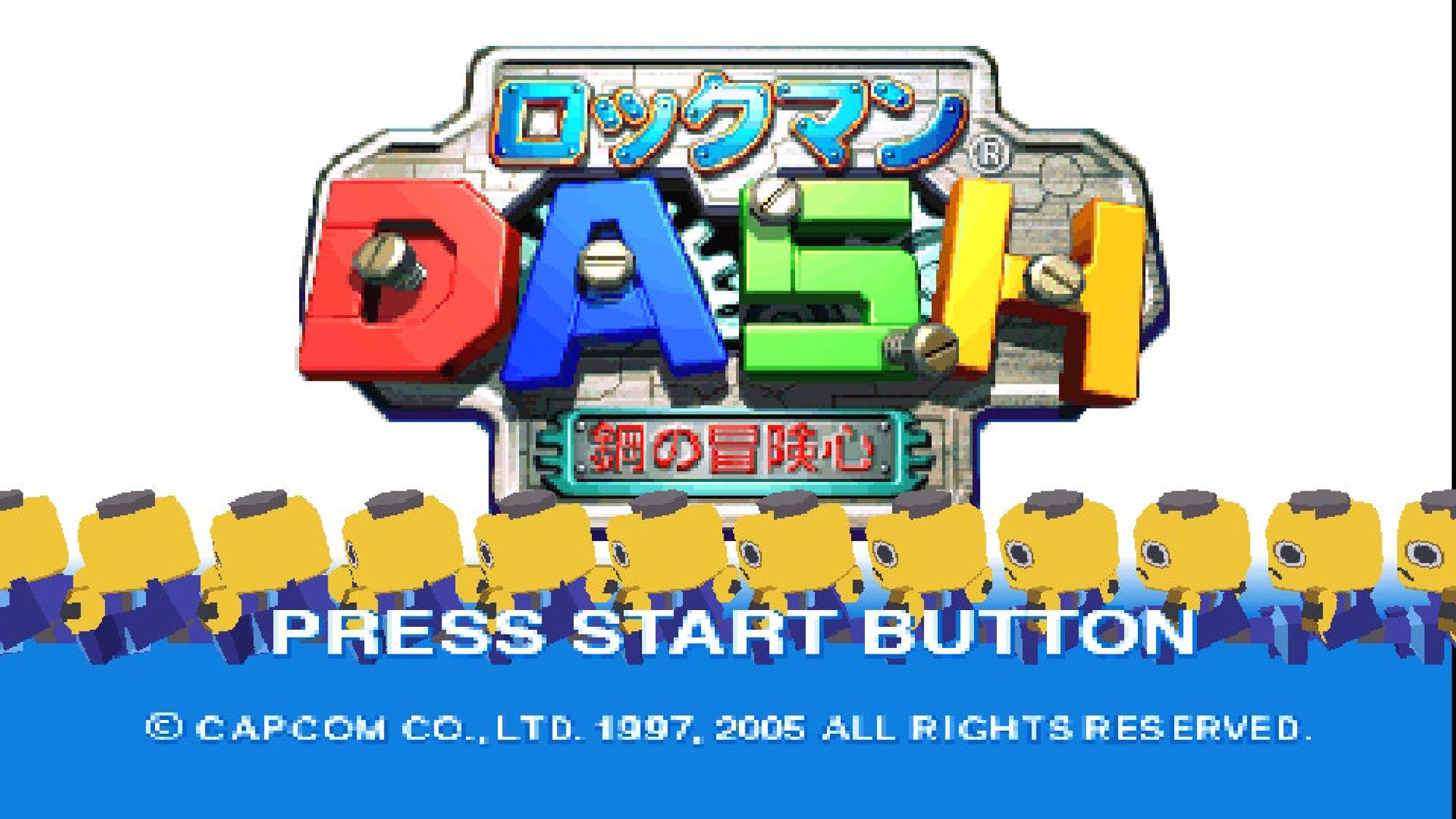 Title screen from the game Rockman DASH Hagane no Bokenshin for the PlayStation Portable handheld. It features the words “Rockman DASH Hagane no Bokenshin” written in Japanese, in the center of a screen with a white background and, in the bottom corner, the sentences: “Press START Button”, “Copyright Capcom Co., Ltd. 1997, 2005” and “All Rights Reserved”. Below the title of the game, there are several “Kobuns” walking around, characters that the protagonist Rockman faces in the game.