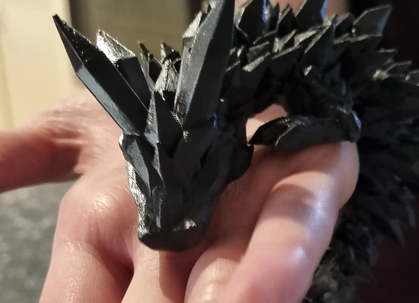 Black spiky dragon fidget figurine