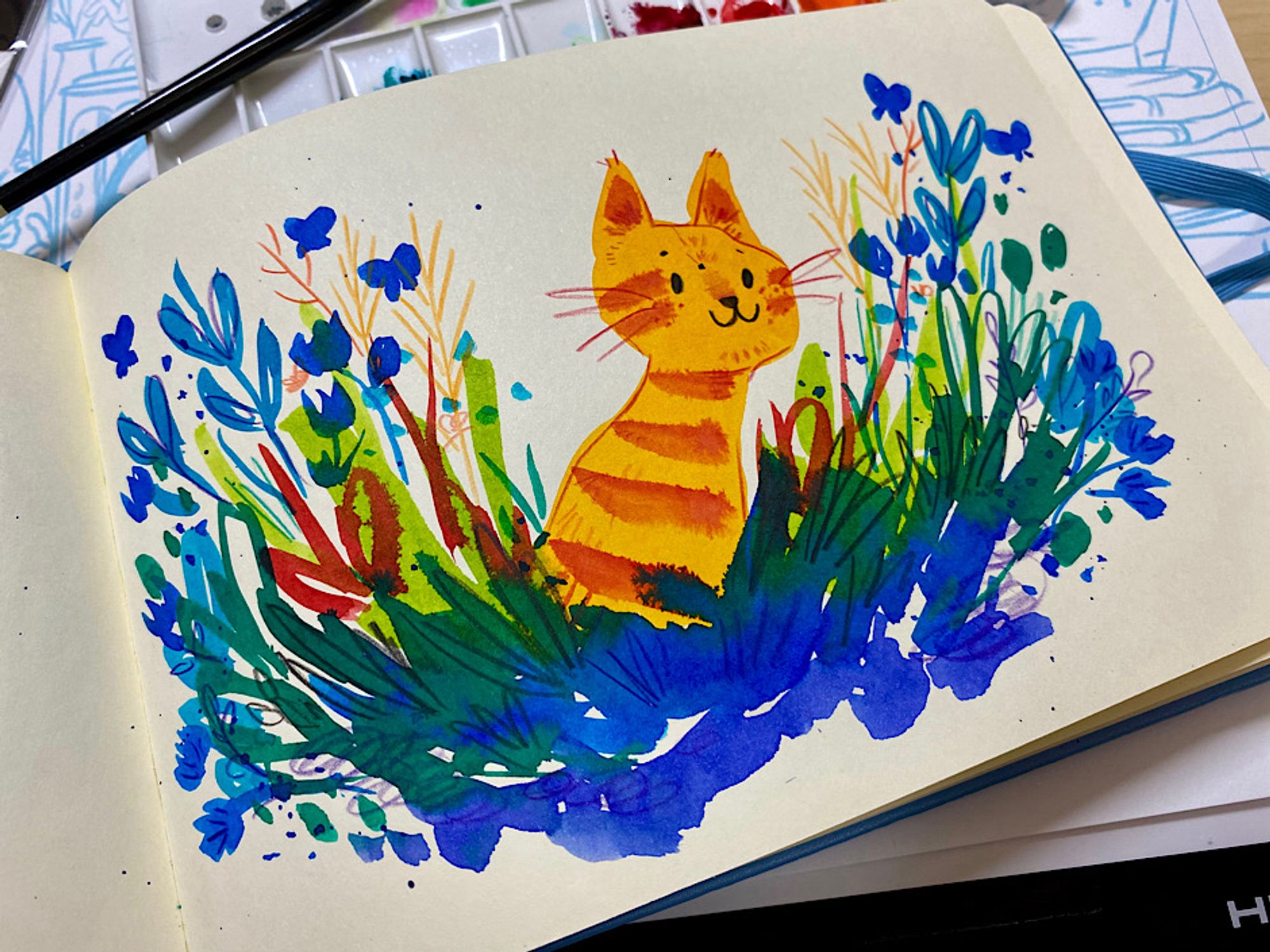 Orange striped cat with blue and green plants