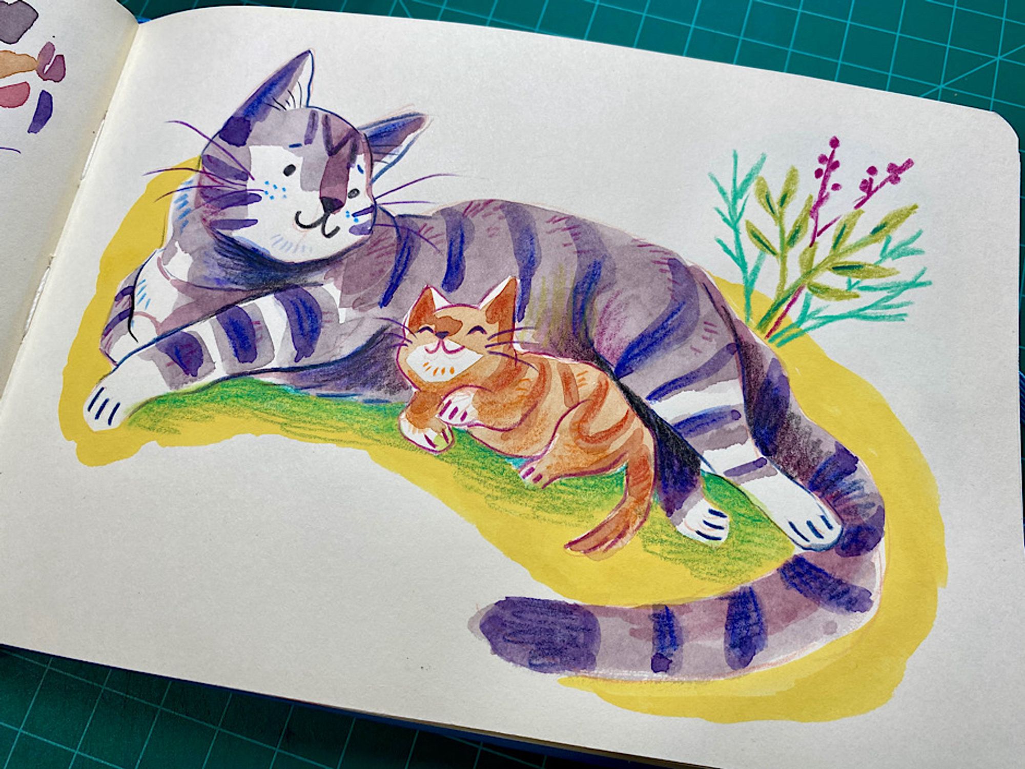 Purple striped mom cat lying down with orange kitten snuggling up beside her. Some colorful plants in background