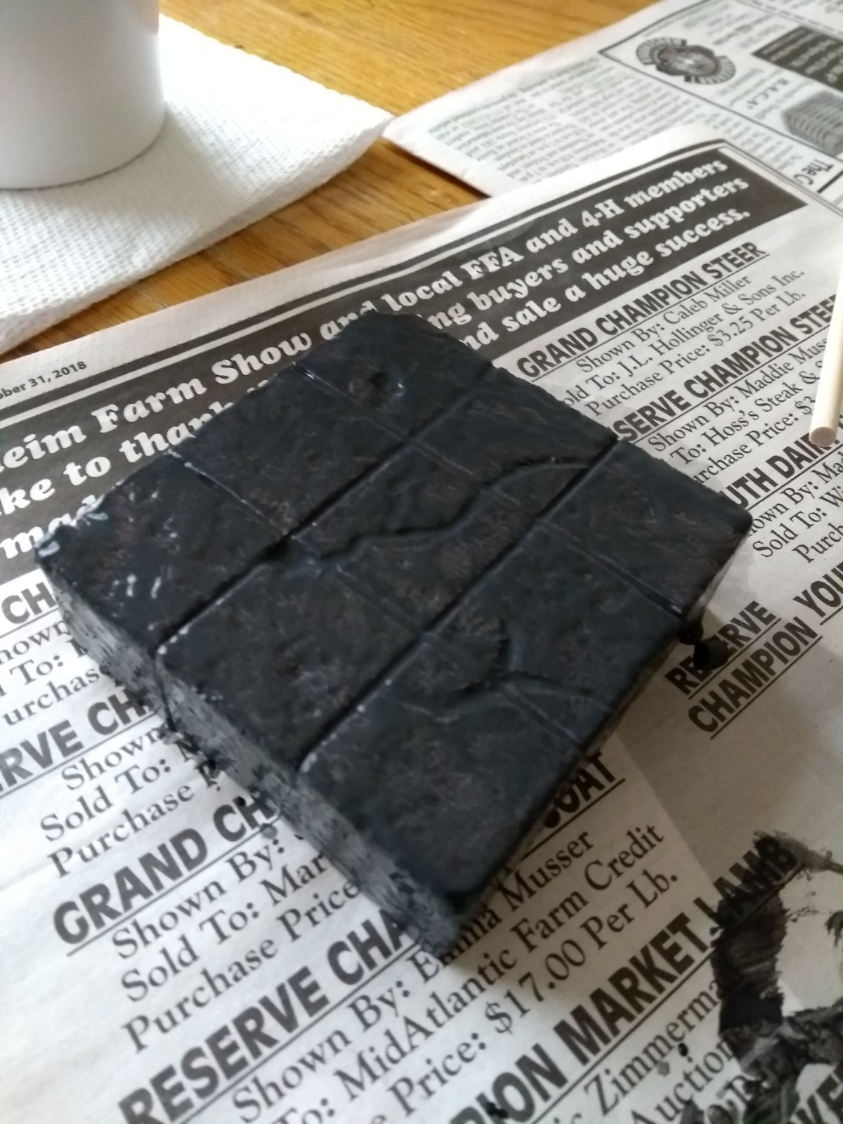 Humble block of foam, grizzled and battered now slathered in a coat of black paint mixed with modpodge to both give a good base coat and a protective layer.