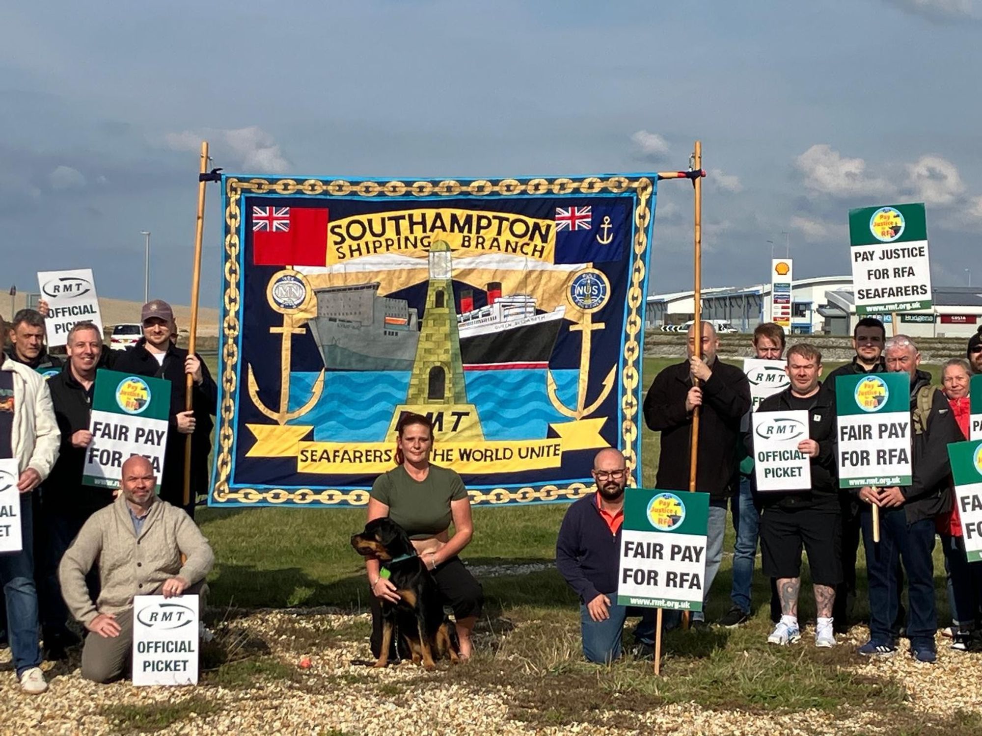 RMT members stand alongside the Southampton Shipping Branch banner as they form a picket line outside Portland Harbour.