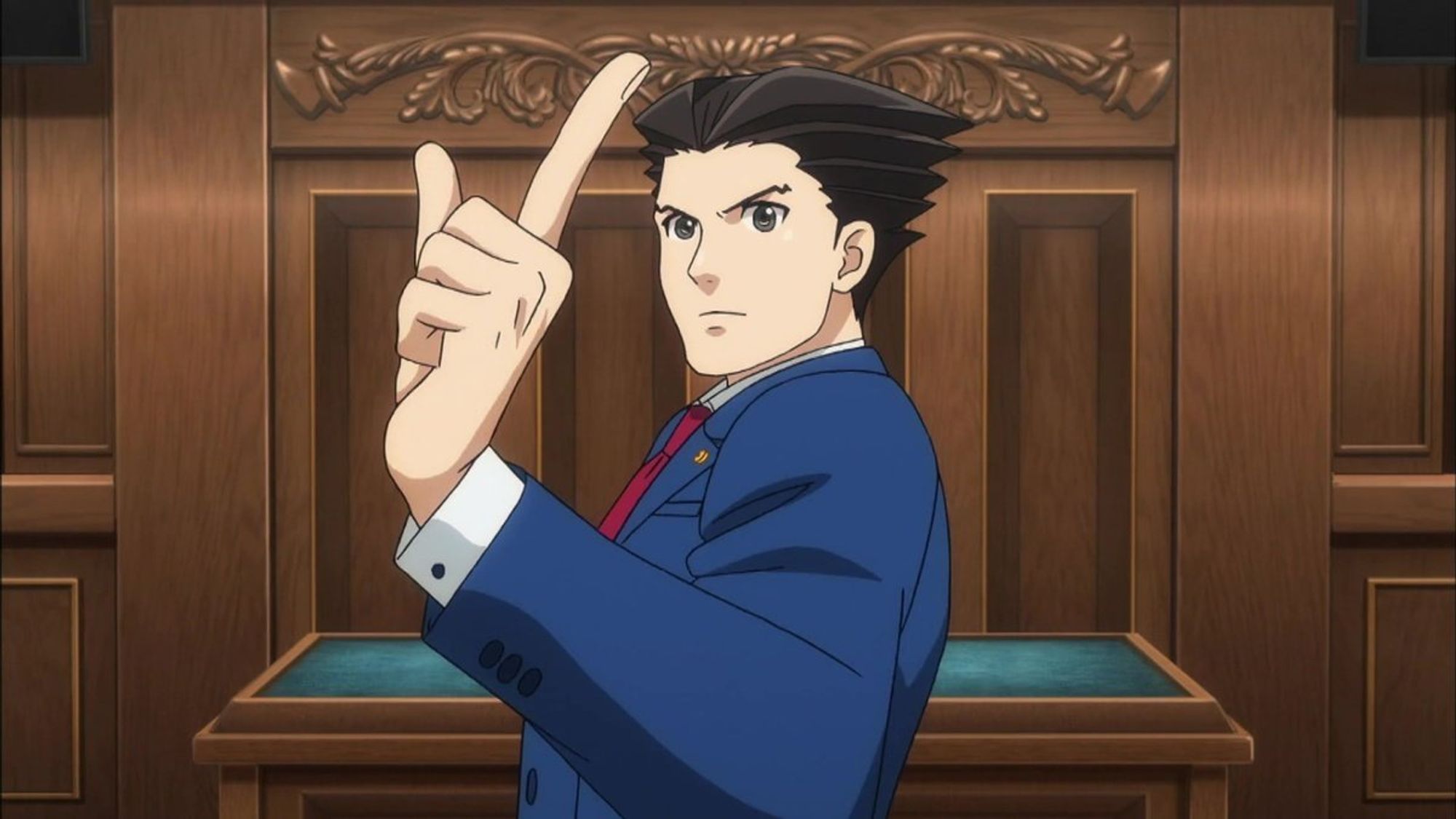 ace attorney phoenix wright in a courtroom - screenshot from the animation series. wright has slicked back black hair and his pupils are as black as his hair. he wears a notable blue suit with red tie. he is in a pose where it looks like he is about to point directly at someone.