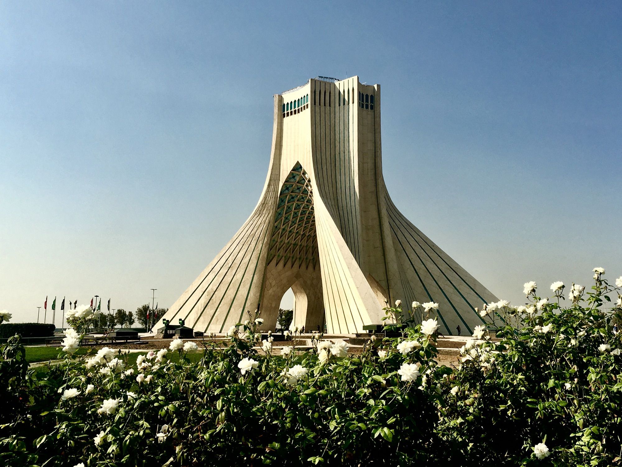 Azadi tower in Tehran (white marble) blue sky, white roses