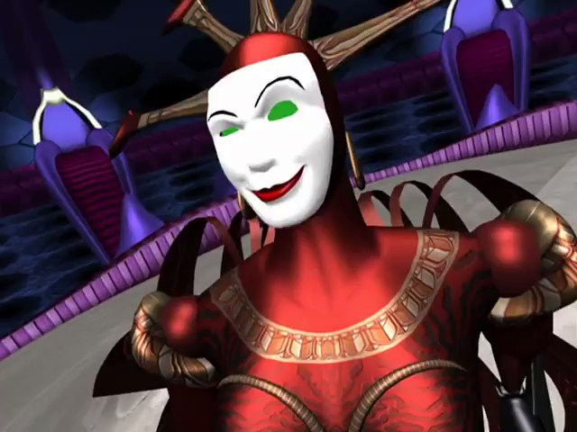 A shot from an episode of Reboot, featuring Hexadecimal, a female virus character. Tall, red, sexually charged, with a mask shaped with a seductive and playful smirk and raised eyebrow