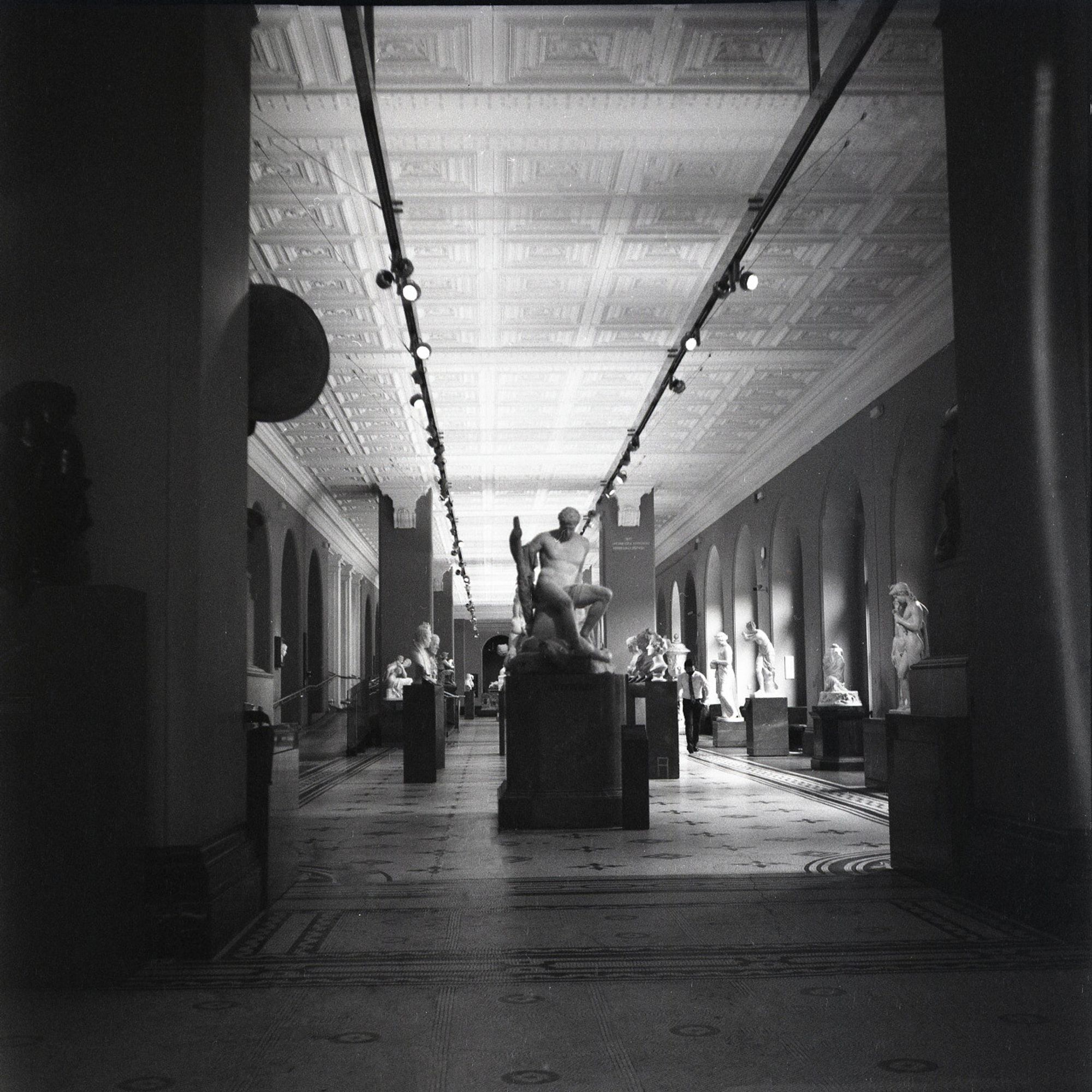 View of a gallery full of statues but empty of people at the V&A