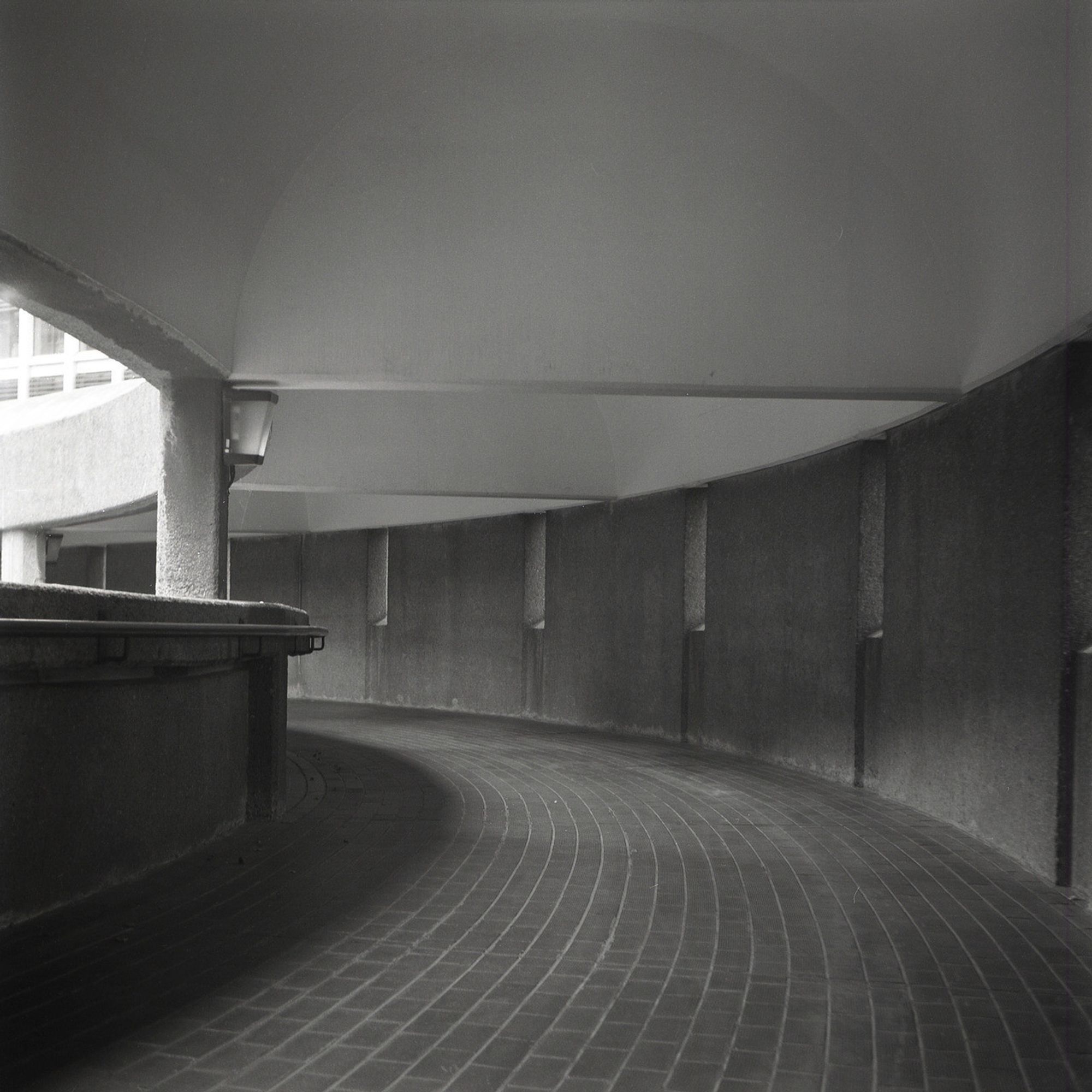 a long curved ramp at the Barbican in London