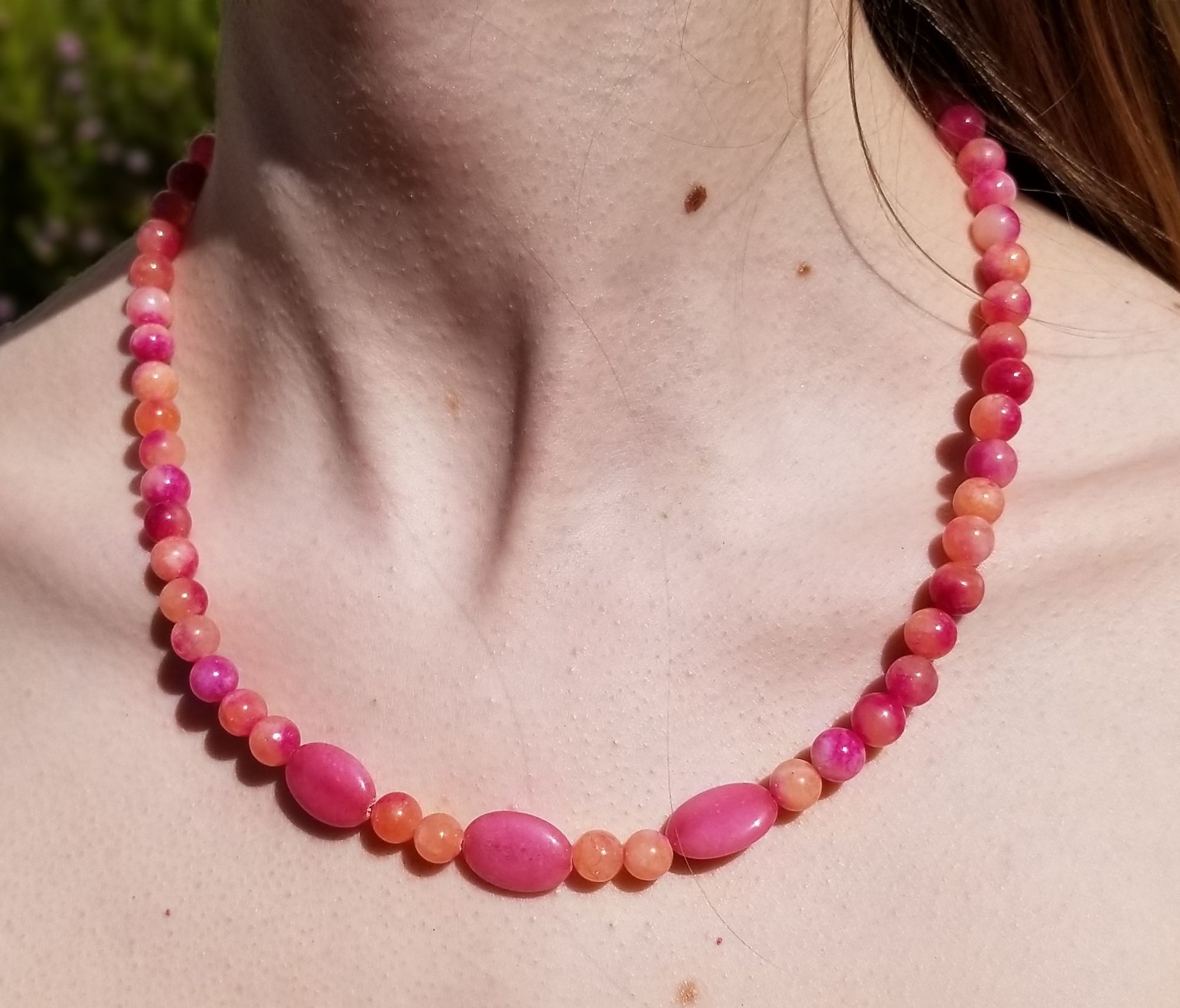 Necklace of...I think the pink is morganite and the orange may be carnelian. 