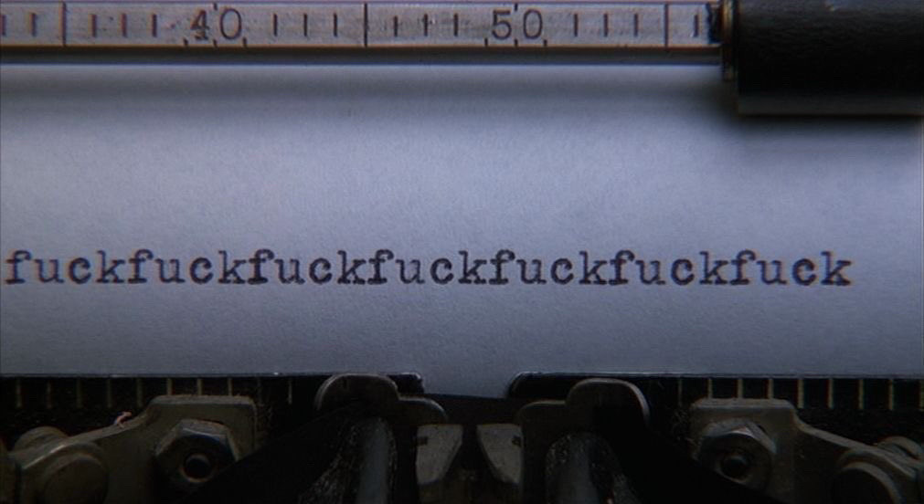 page on a typewriter with written "fvck" quite a lot amount of time