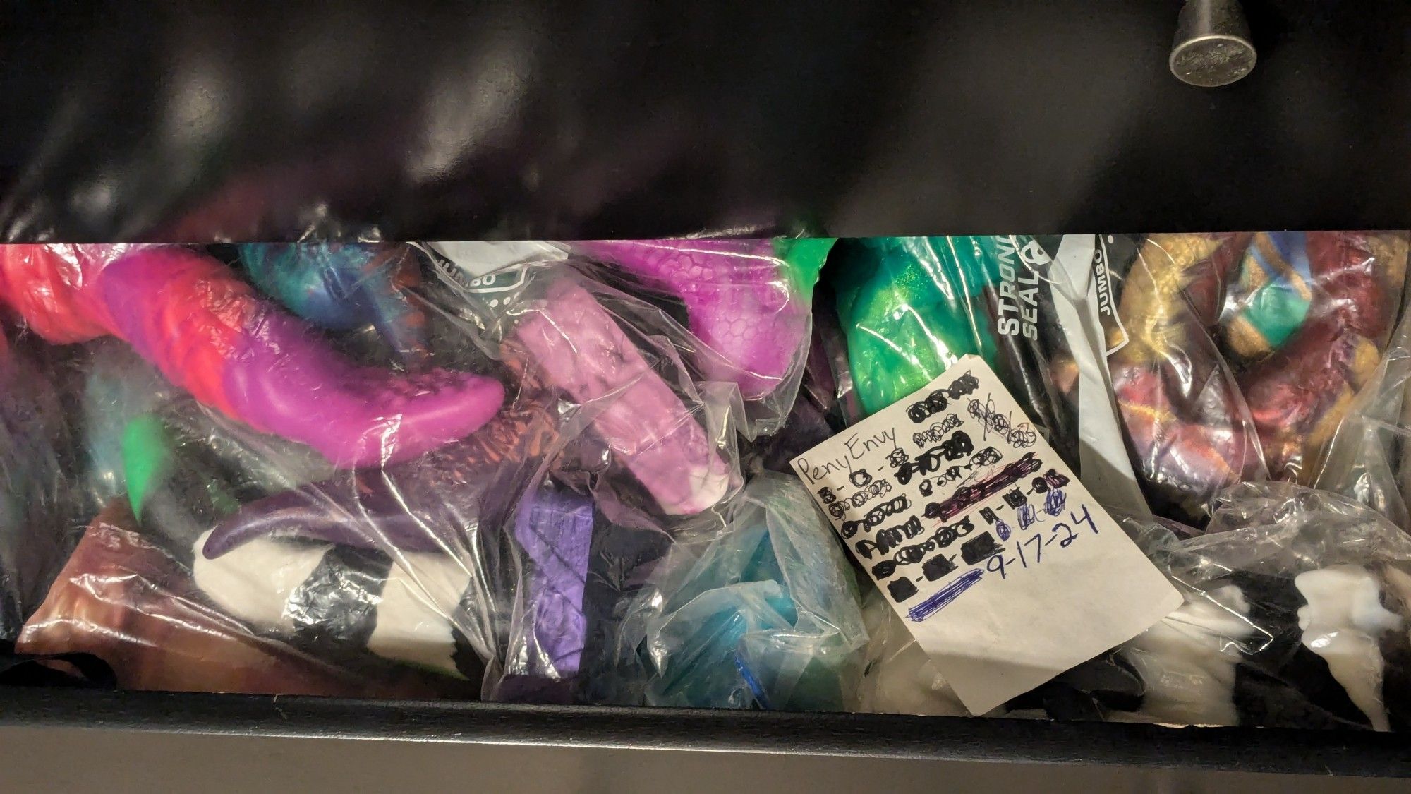 A timestamp with several bagged silicone toys for sale