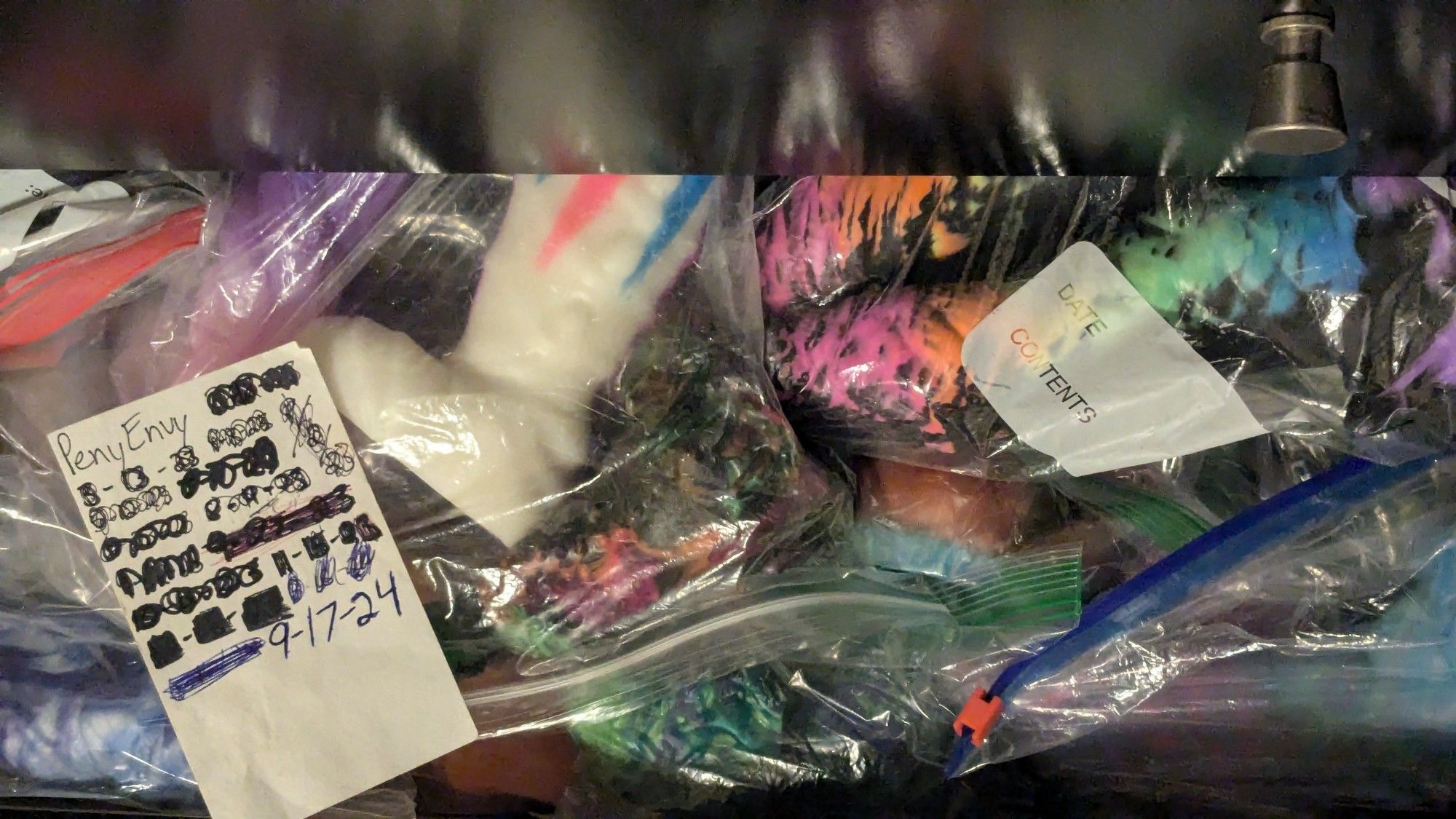 A timestamp with several bagged silicone toys for sale