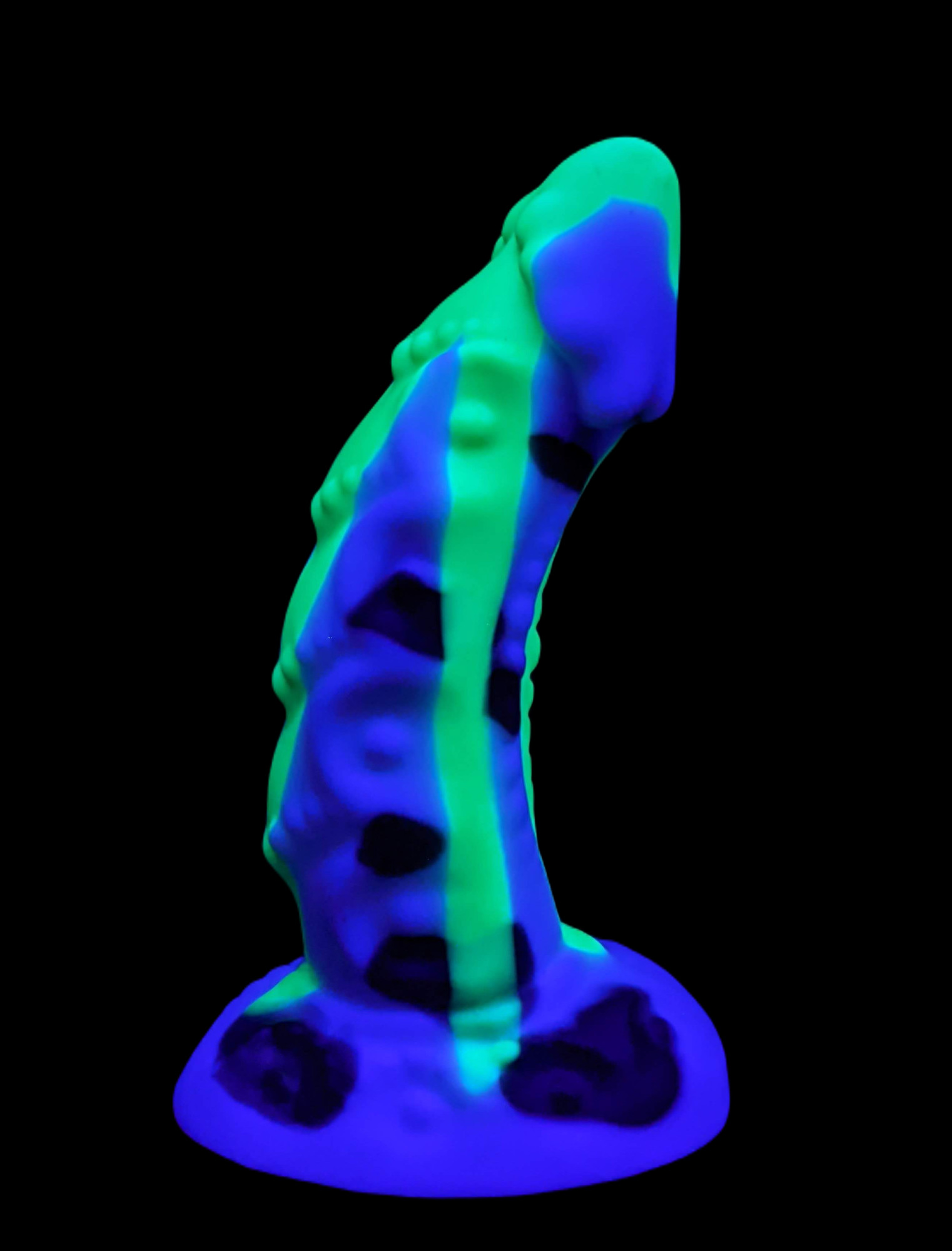 UV of white dong with black spots and a neon green drip (right side)