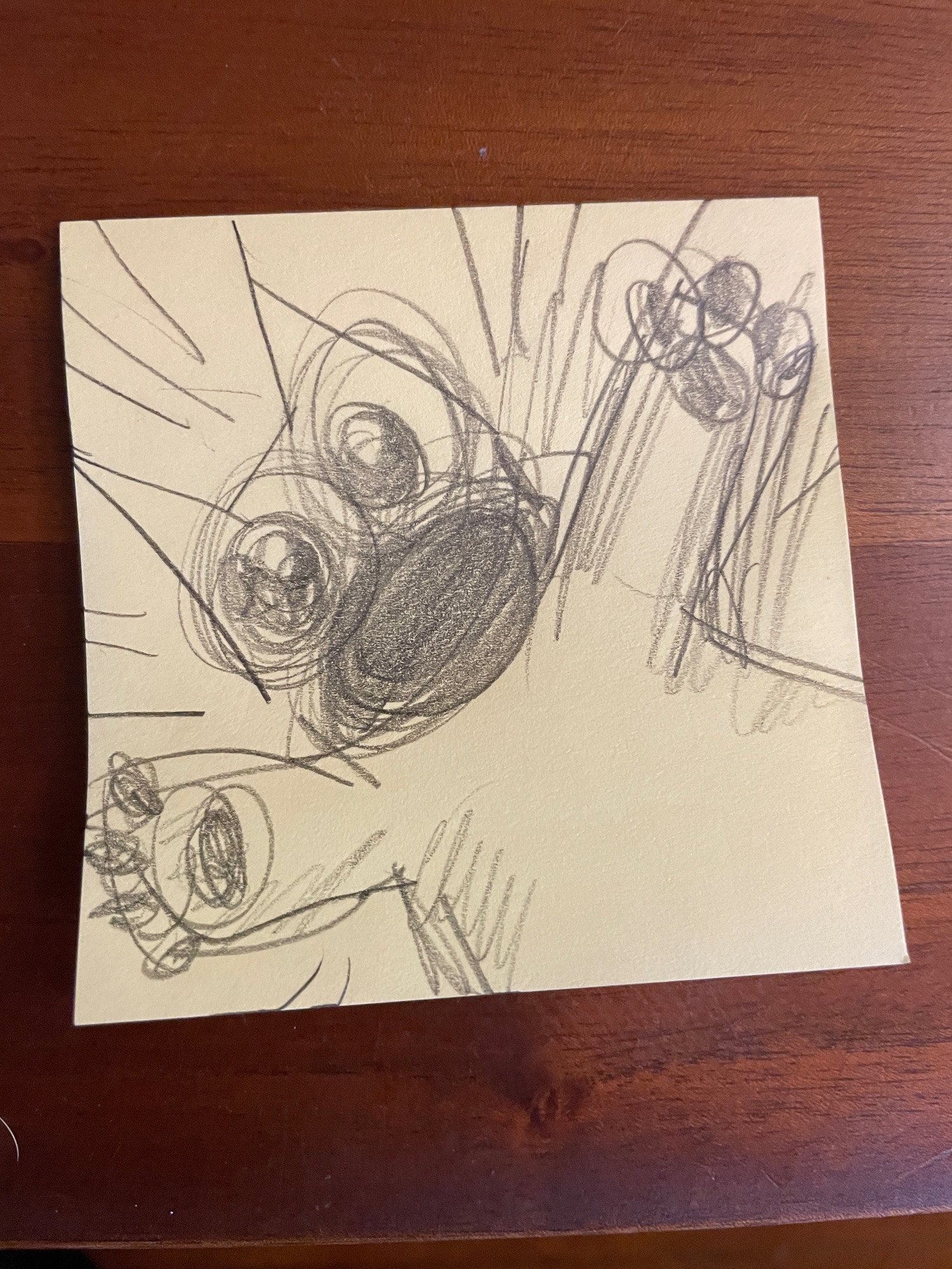 A drawing of a cartoon cat on a post-it note falling down into an infinite space, screaming