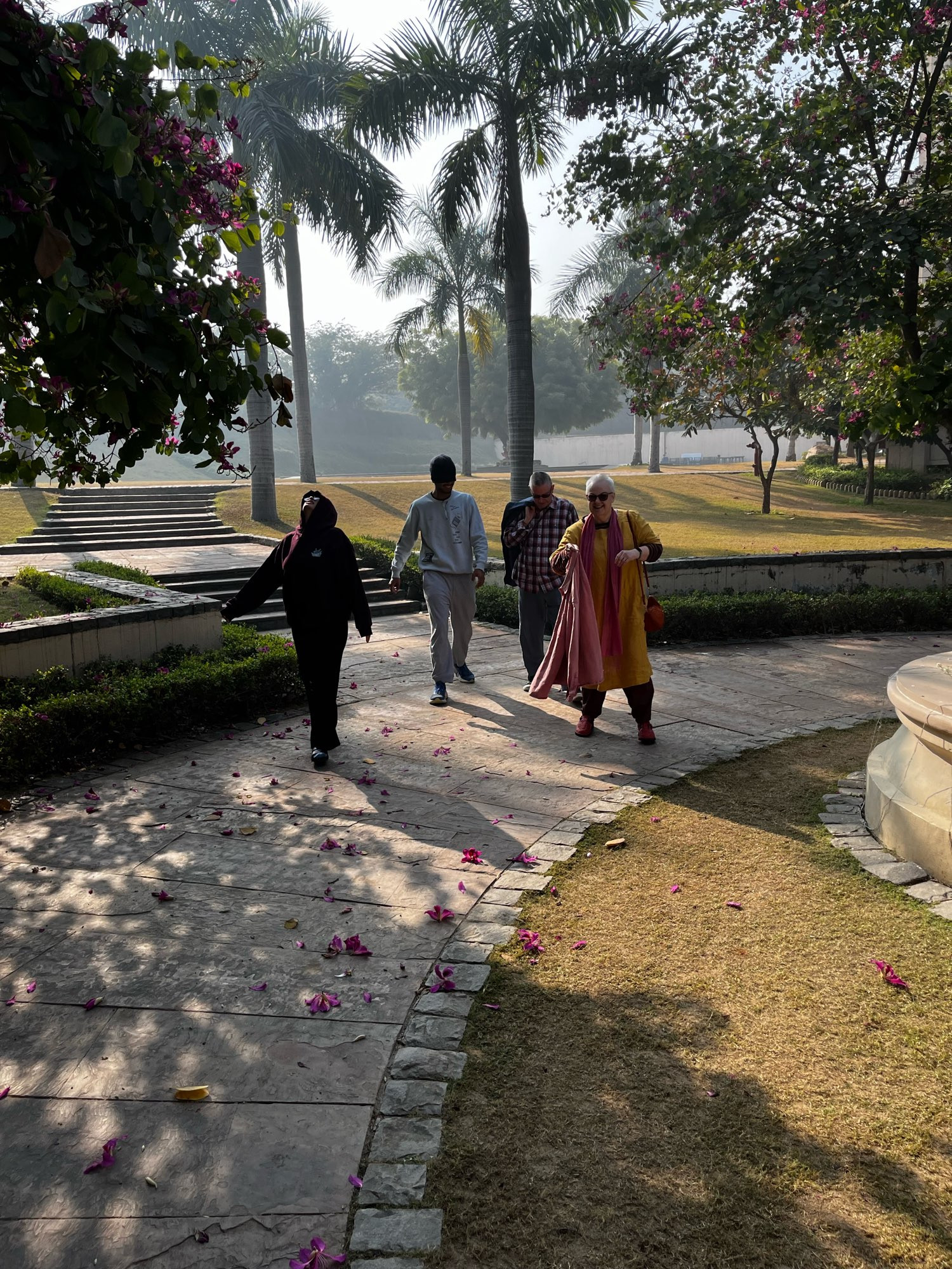 Beloved humans walking on a flower strewn path